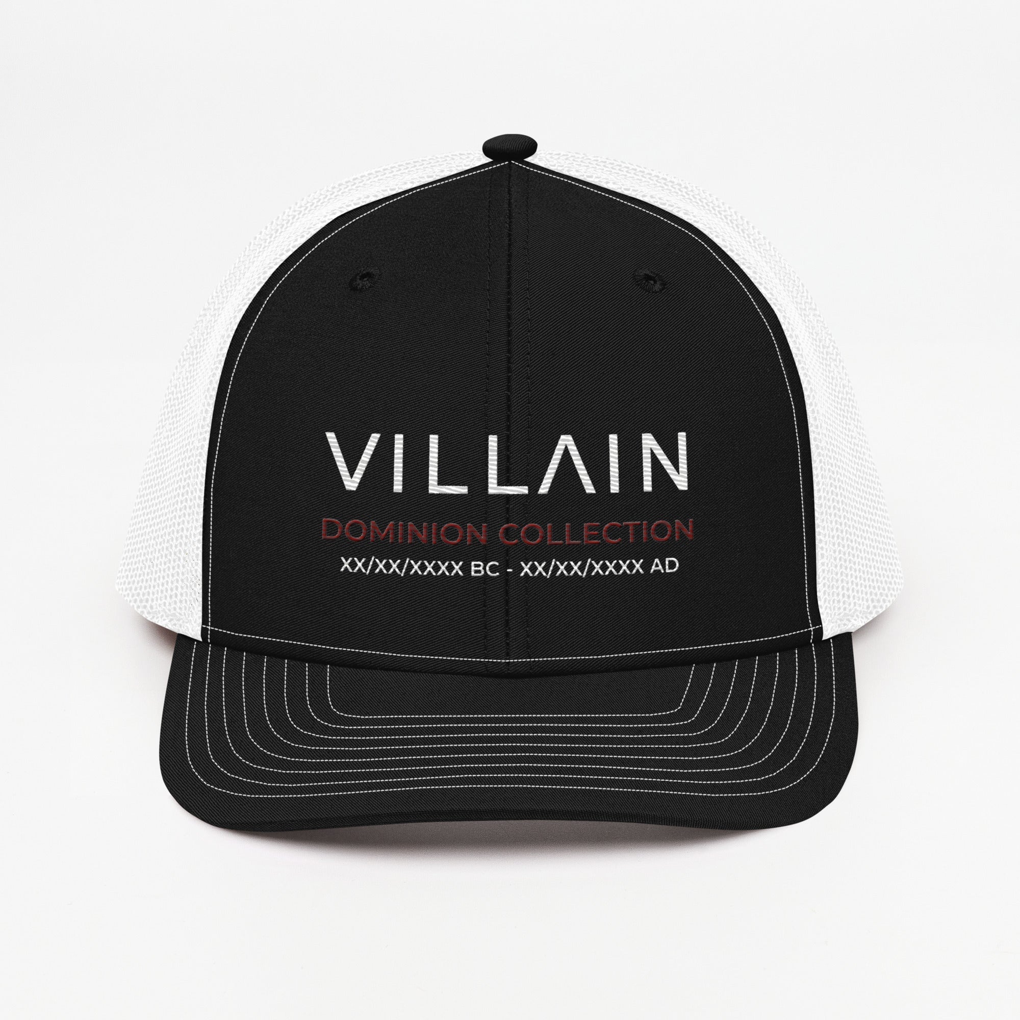 Black and white trucker cap with 'VILLAIN Dominion Collection' embroidered on front panel.