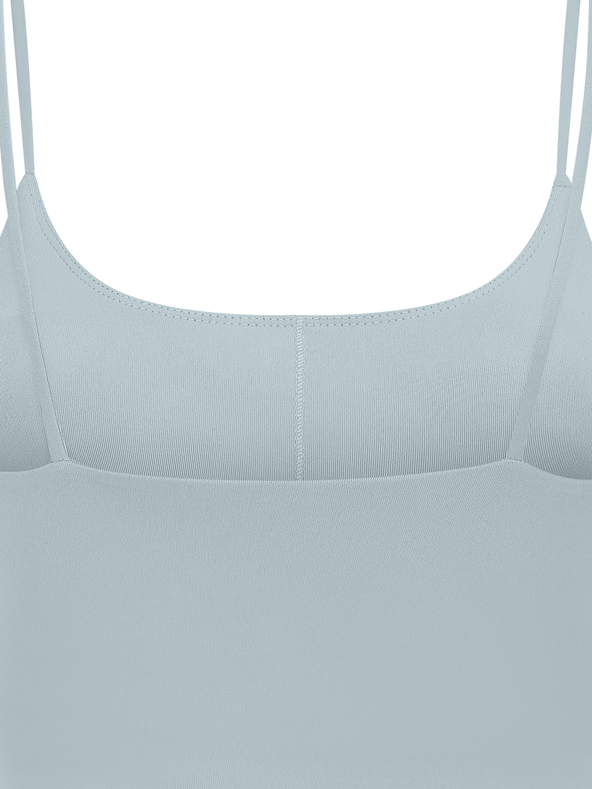 Light blue spaghetti strap yoga sports bra with seamless front design