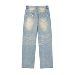 Back view of light wash denim jeans with faded details, distressed pockets, and raw hem.