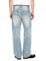 Back view of light wash, raw hem denim jeans with faded and distressed details