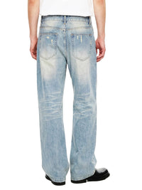 Back view of light wash, raw hem denim jeans with faded and distressed details