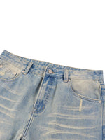 Light blue raw hem denim jeans with sun-fade wash and subtle distressed details