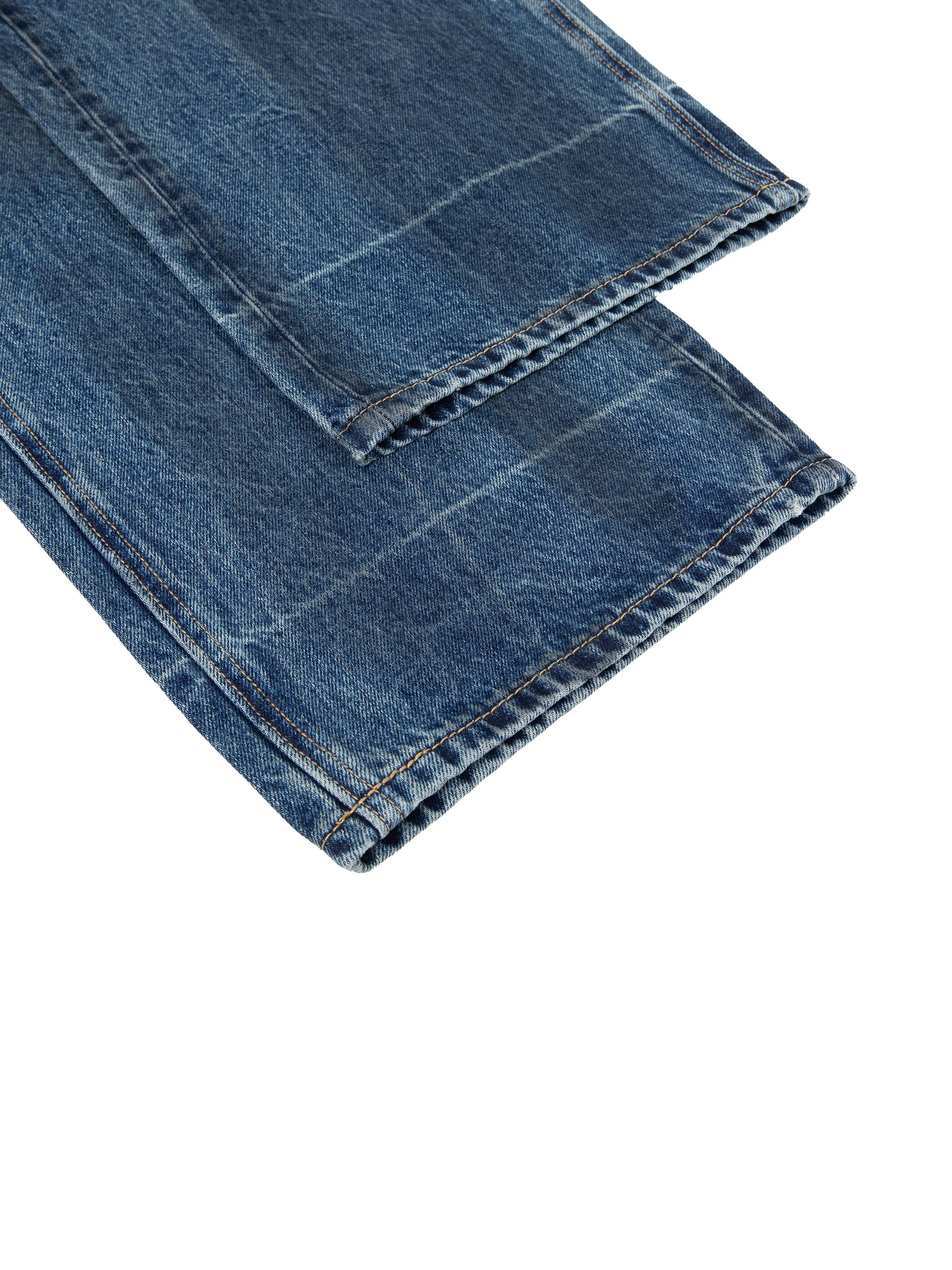Vintage wash baggy denim jeans with visible stitching and straight leg cuffs