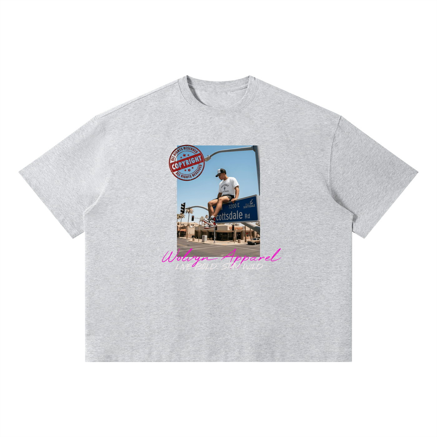 Light gray unisex boxy streetwear t-shirt with city graphic and pink text on front
