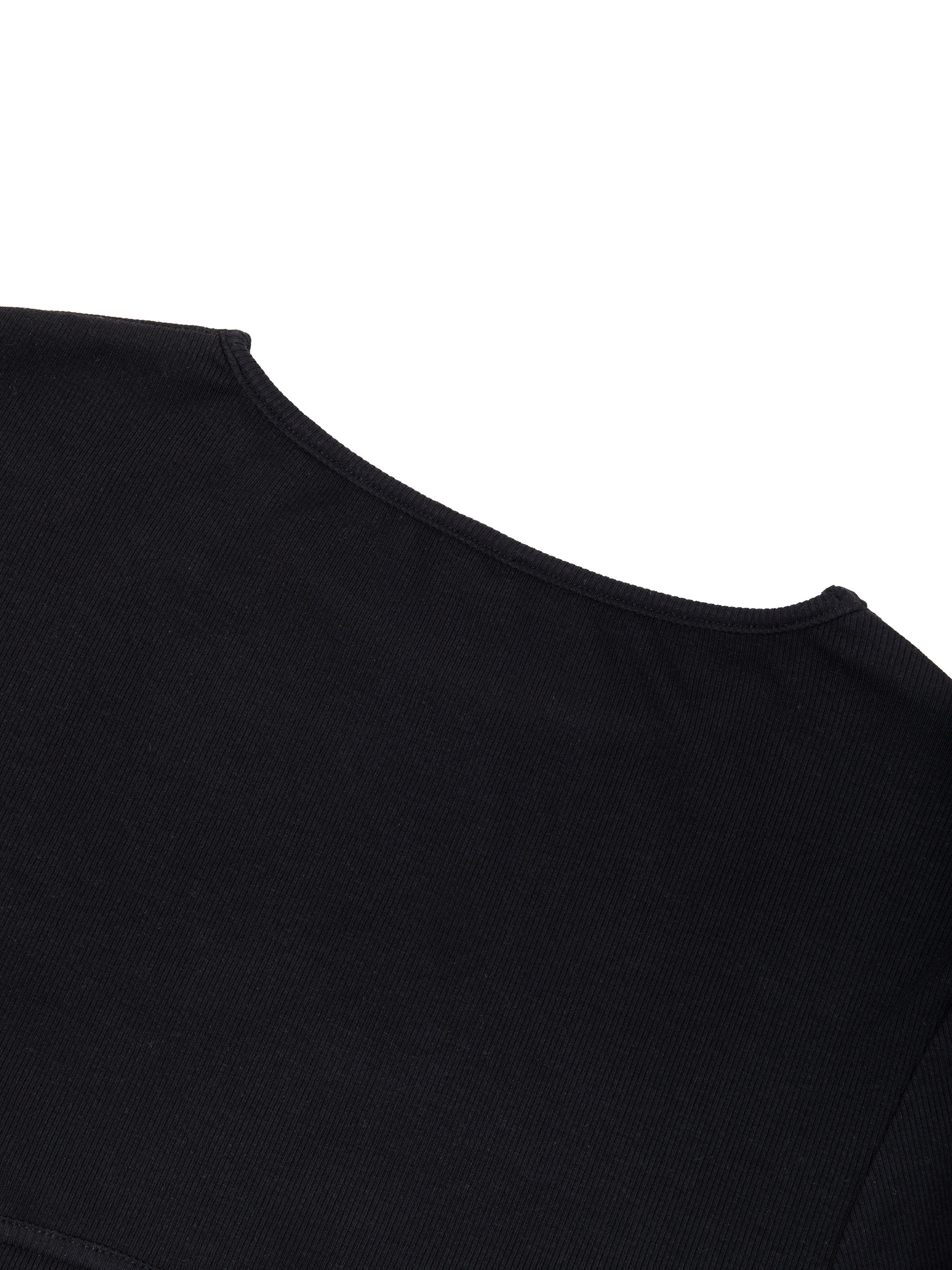 Close-up of black slim fit women's boatneck t-shirt neckline on plain background