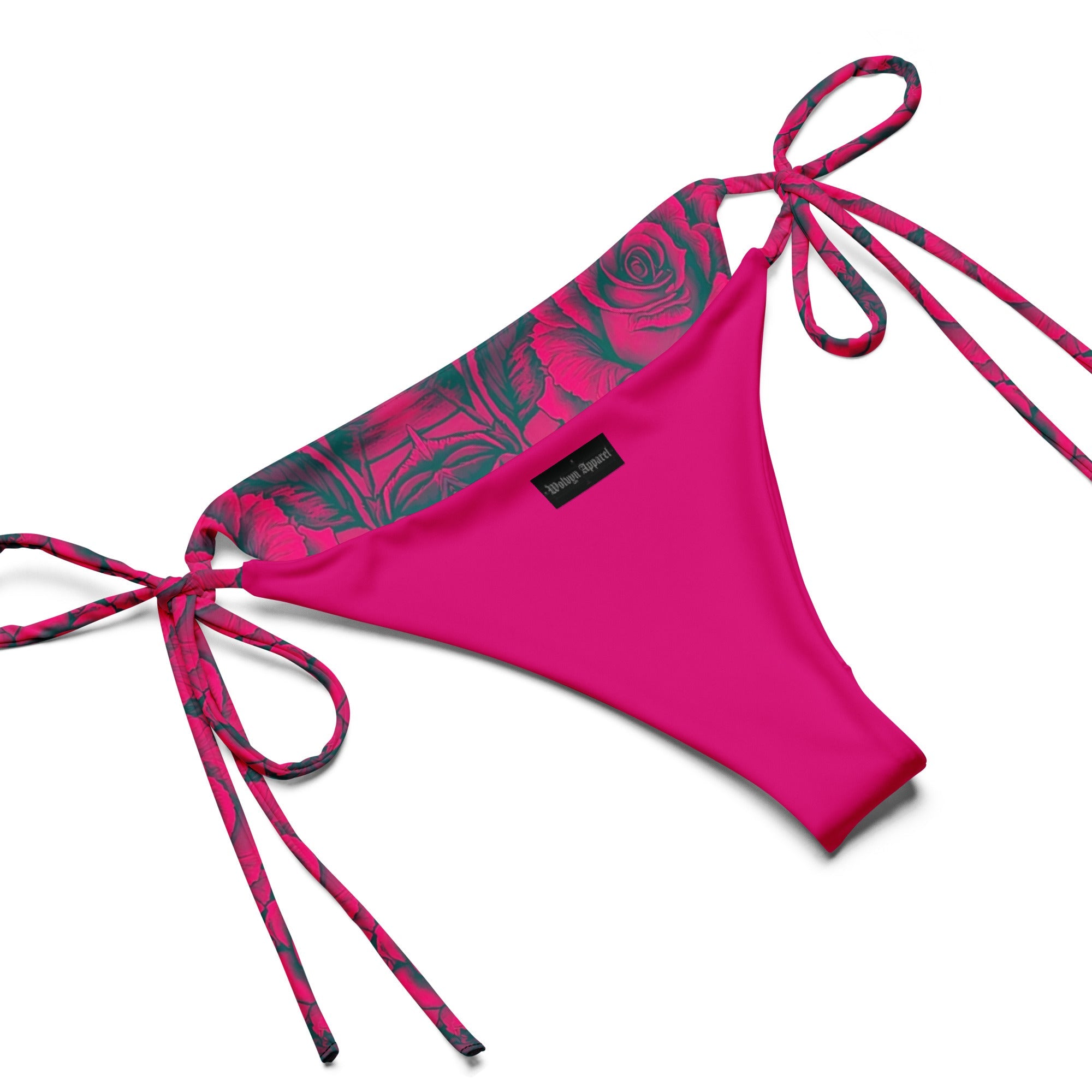 Pink string bikini bottom with rose pattern trim and side ties on white background