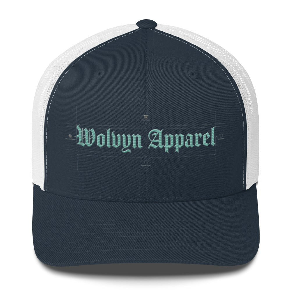 Navy and white mid-profile trucker cap with embroidered 'Wolvyn Apparel' text on front