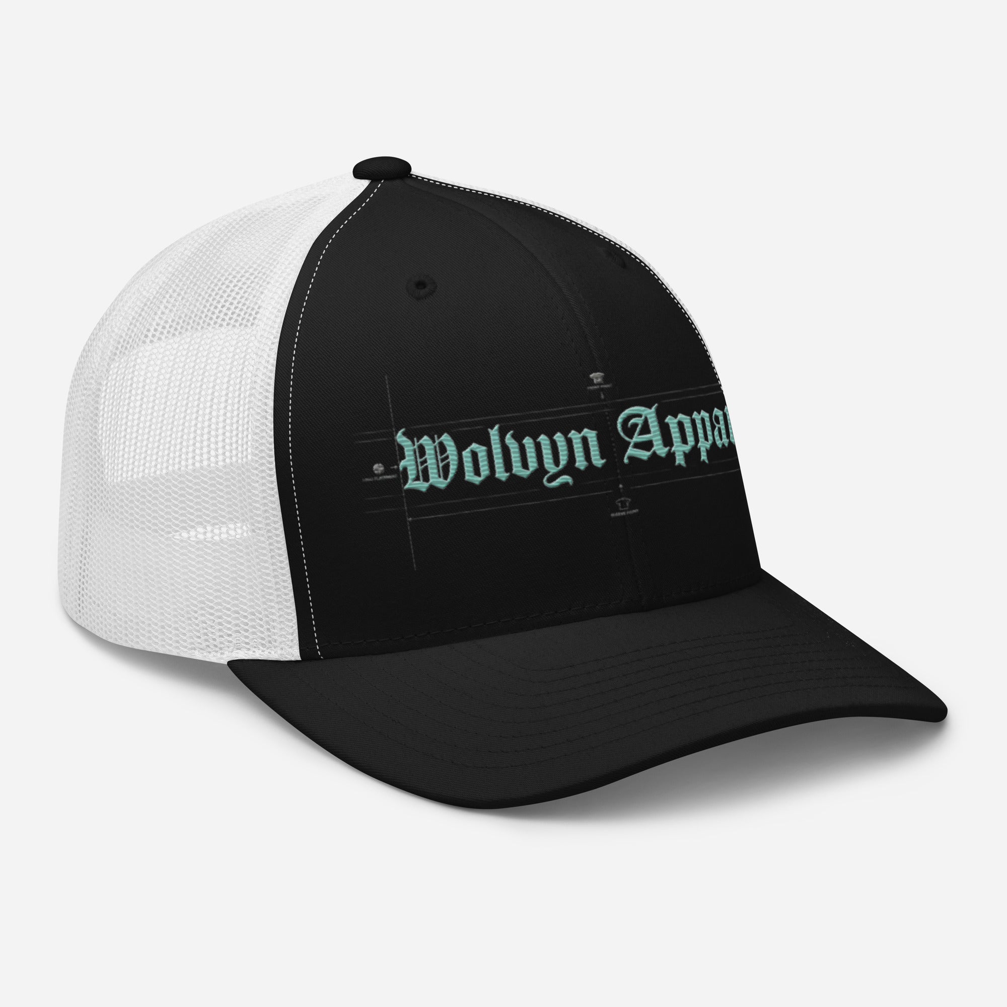 Black and white mid-profile trucker cap with mesh back and embroidered Wolvyn Apparel text