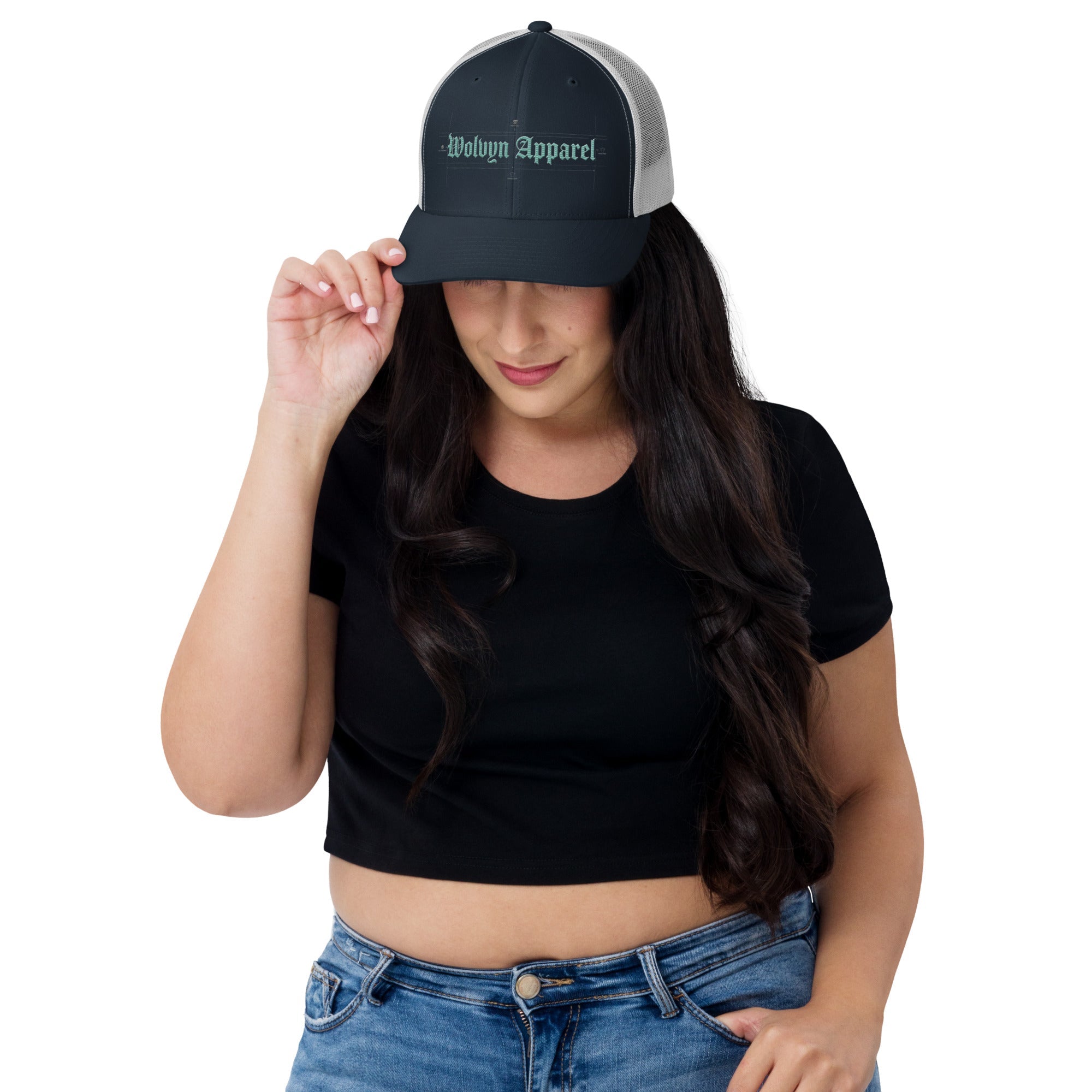 Woman wearing a mid-profile embroidered trucker cap with mesh back and gothic text front