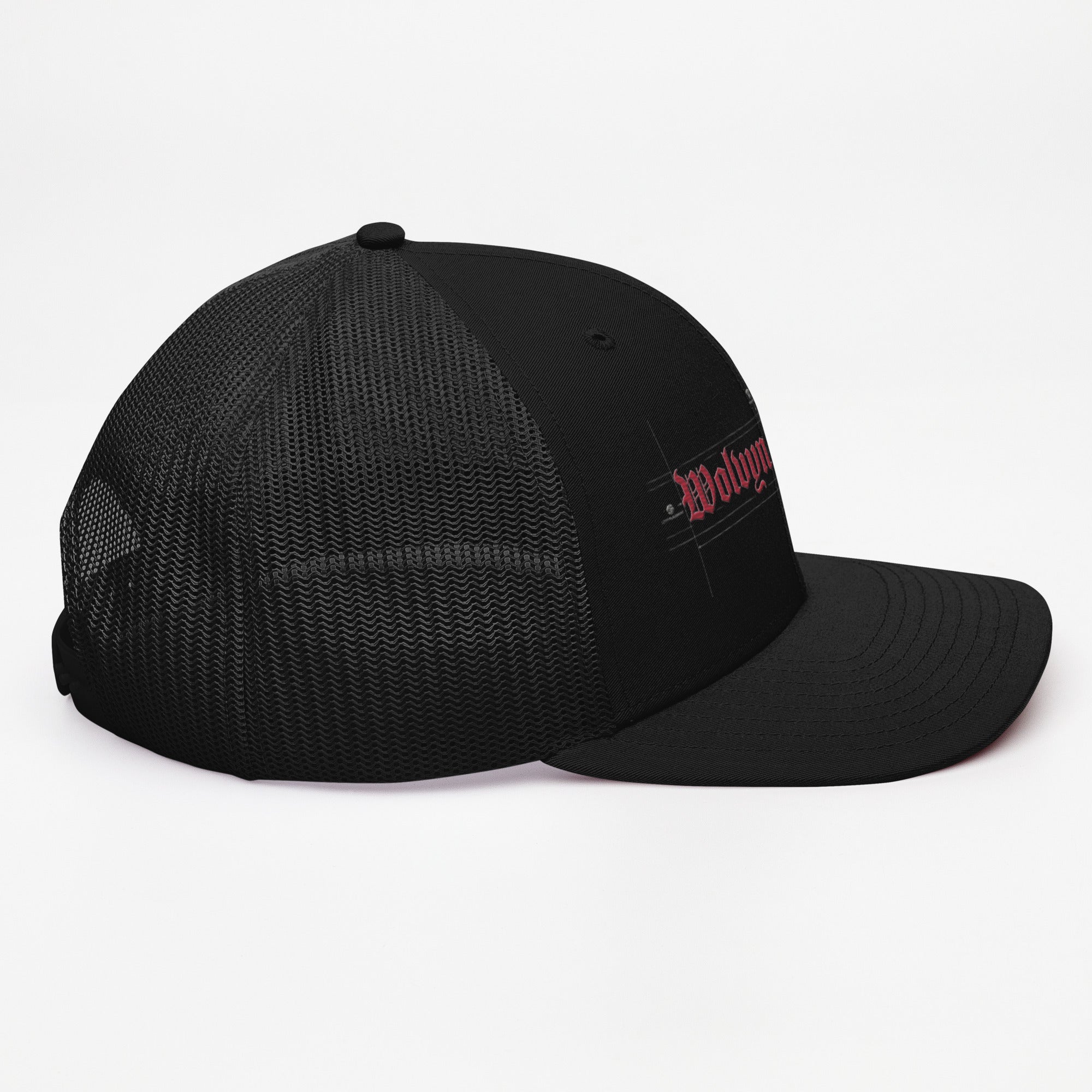 Black Richardson trucker cap with red embroidered logo and mesh back, streetwear style