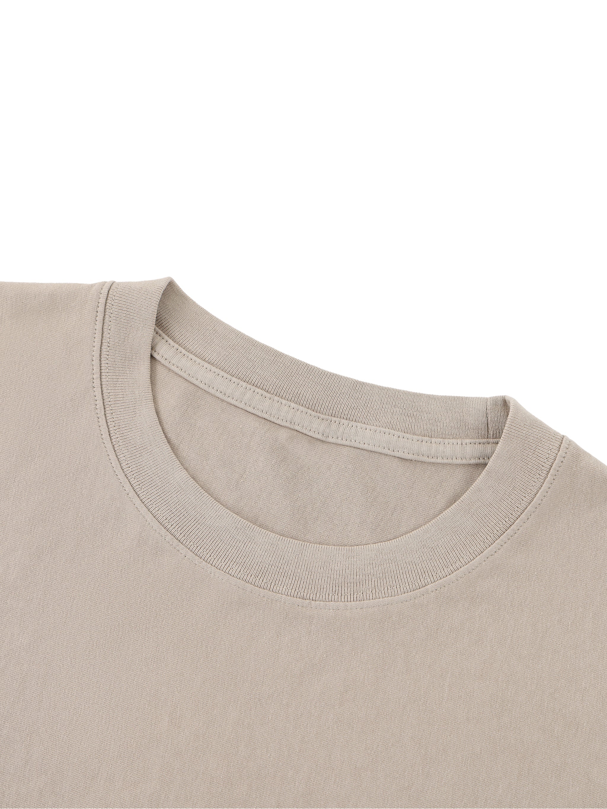 Beige heavyweight unisex t-shirt with boxy fit and raw edge detail, close-up view