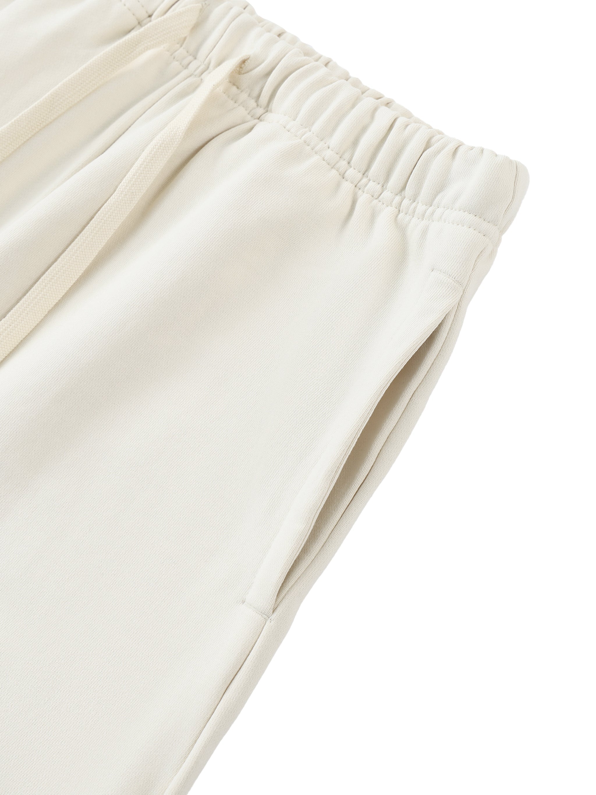 Beige heavyweight cotton sweatpants with elastic waistband and side pocket