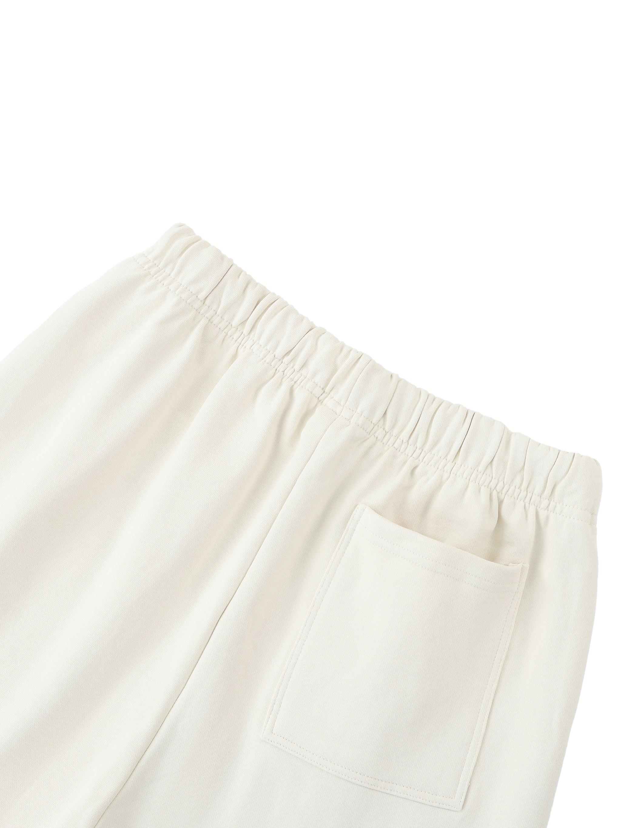 Cream heavyweight cotton sweatpants with elastic waistband and back pocket on white background
