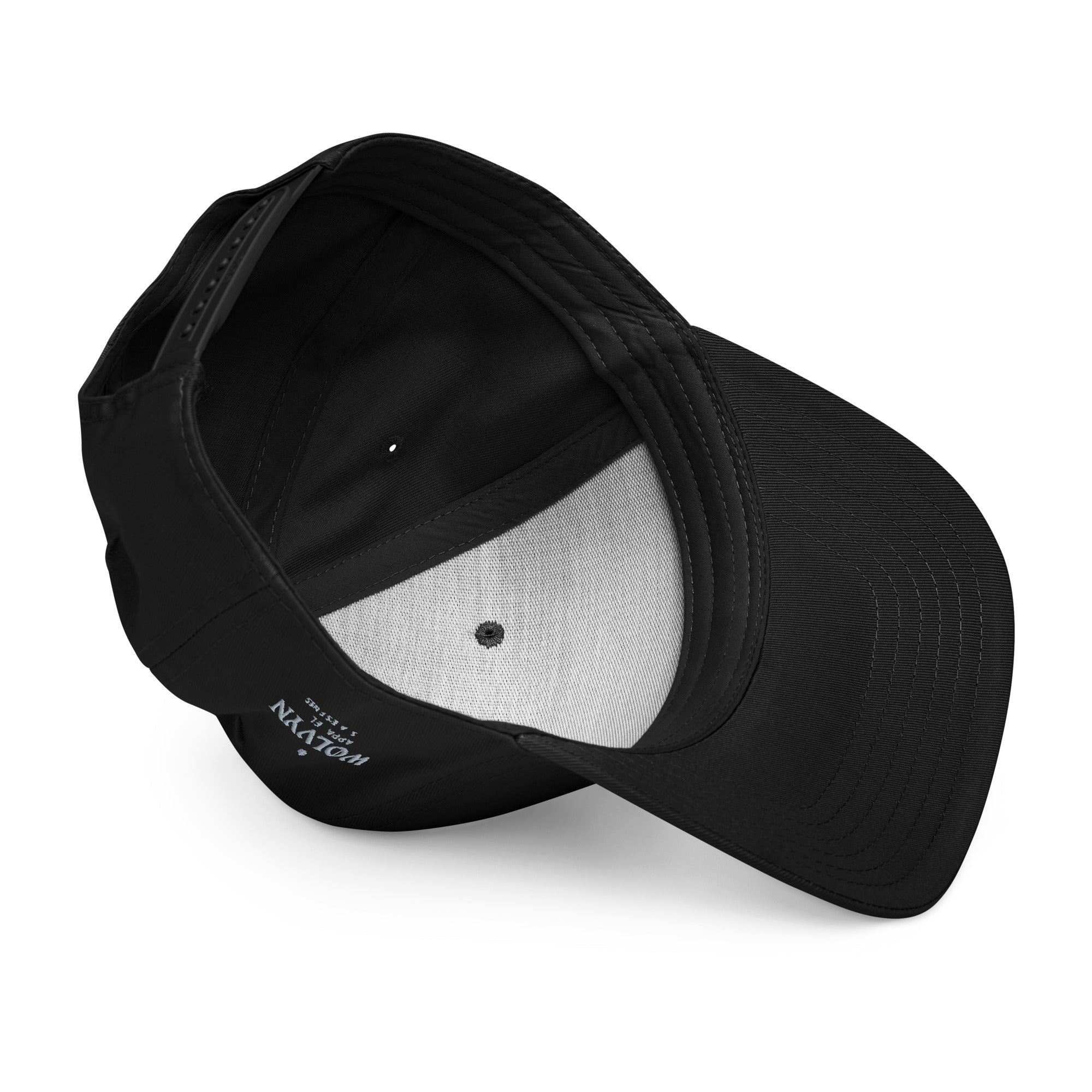 Inside view of a black 5 panel cap with adjustable strap and curved brim