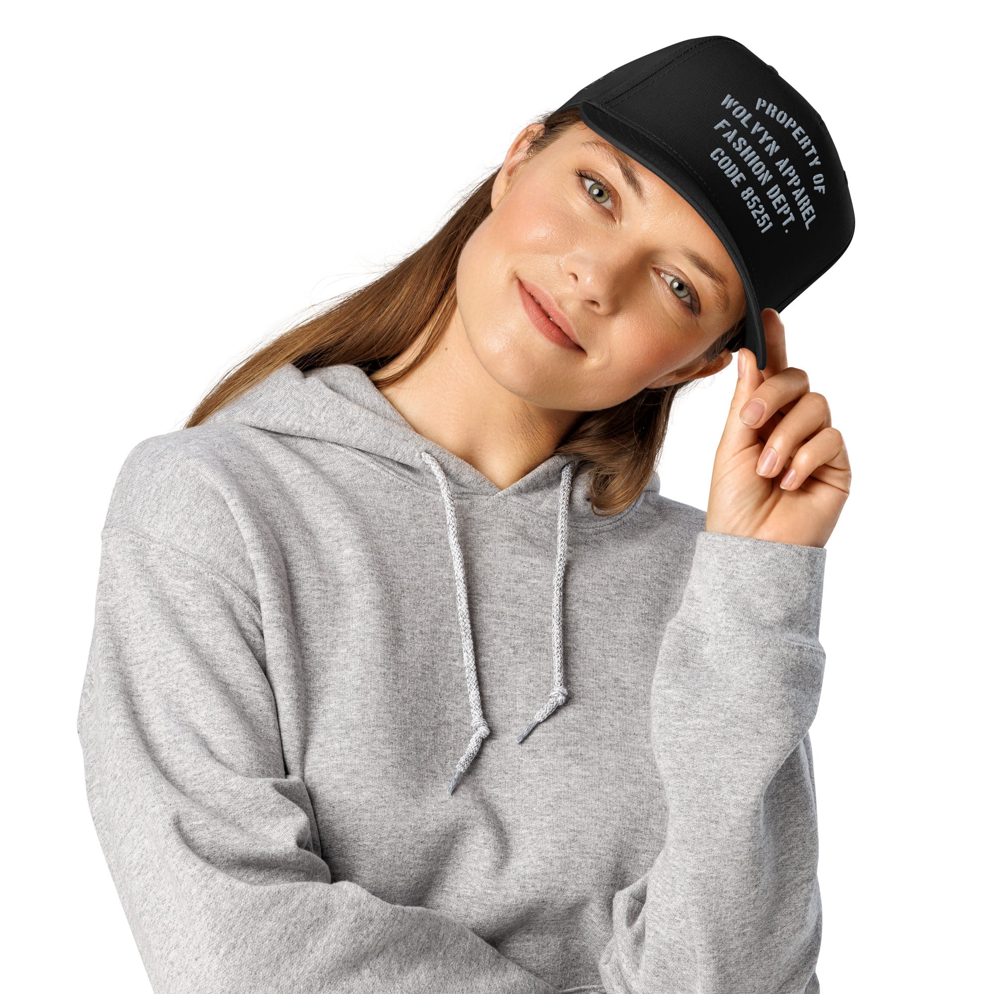 Woman wearing a black 5-panel cap with white text and a light grey hoodie