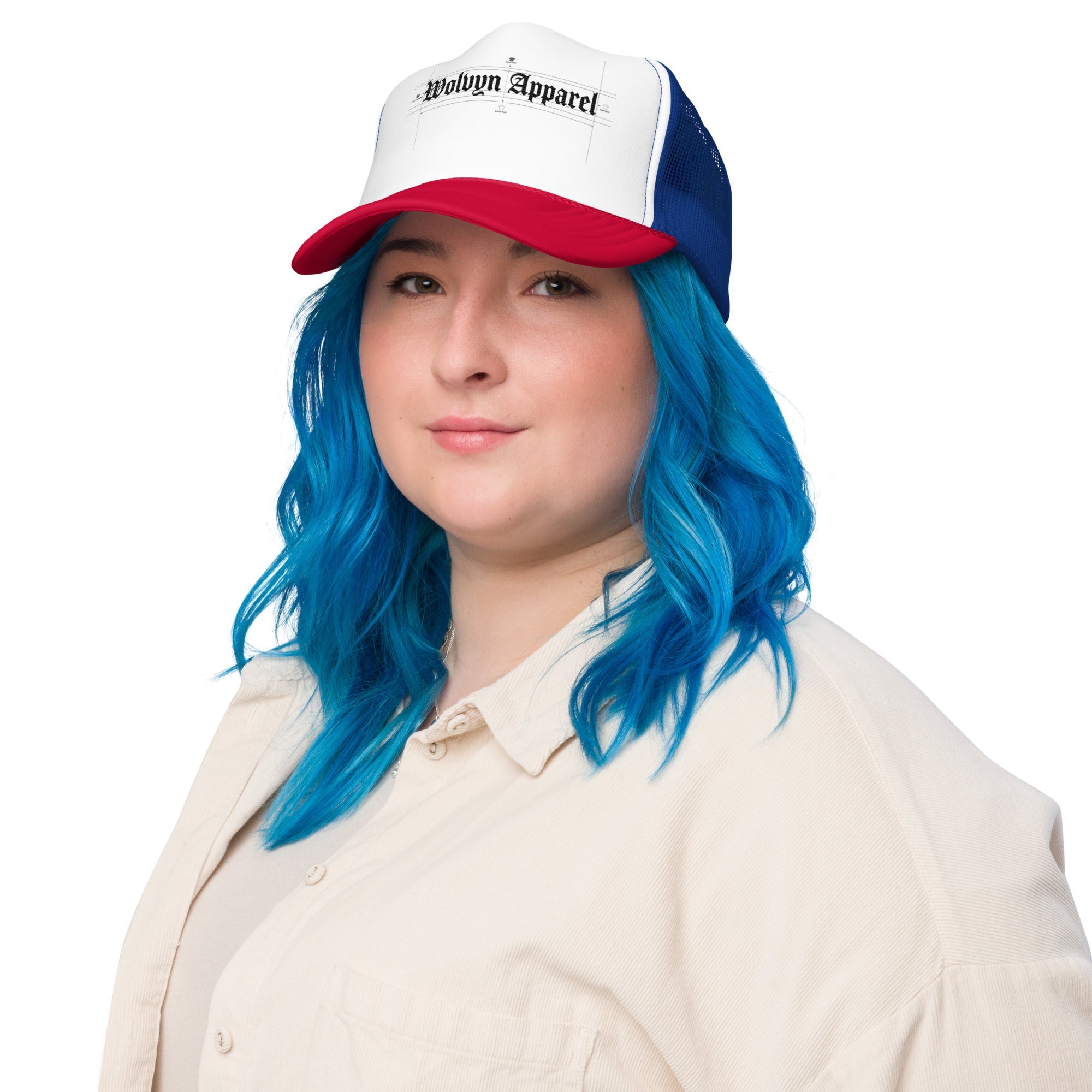 Woman with blue hair wearing a white, red, and blue foam trucker hat with Wolvyn Apparel logo