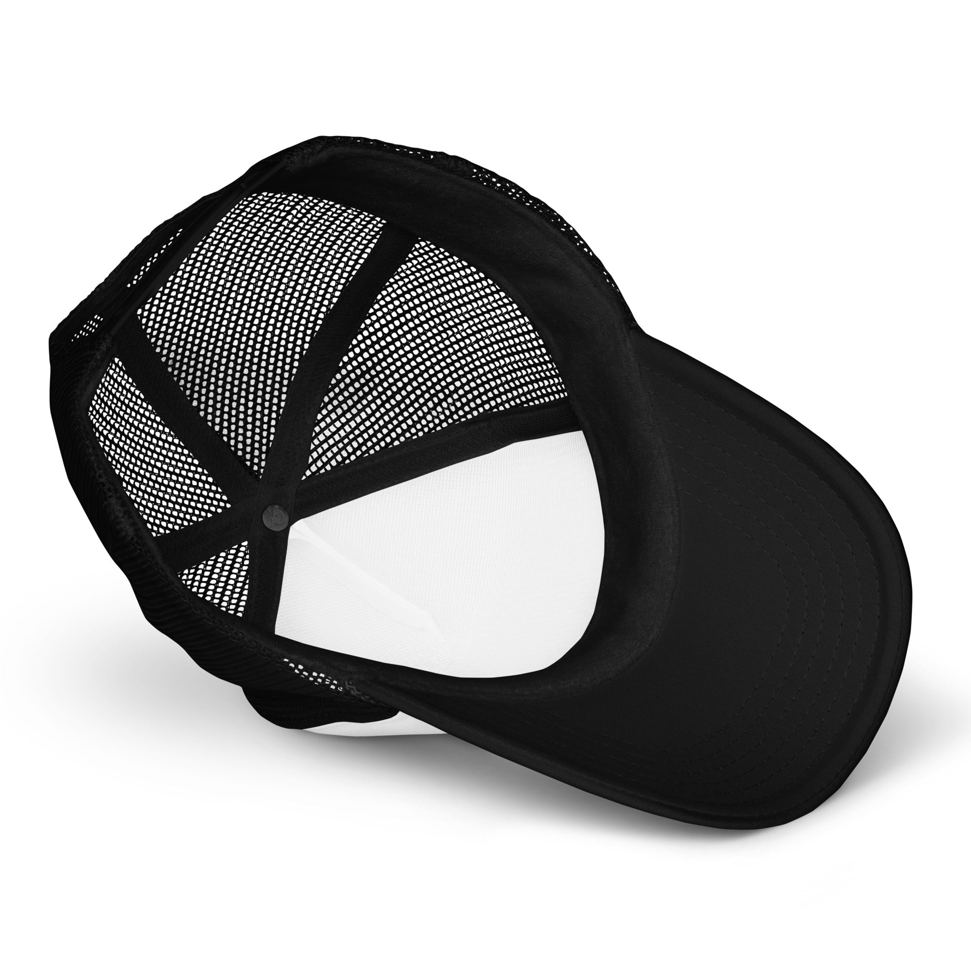 Inside view of black mesh foam trucker hat with curved bill on white background