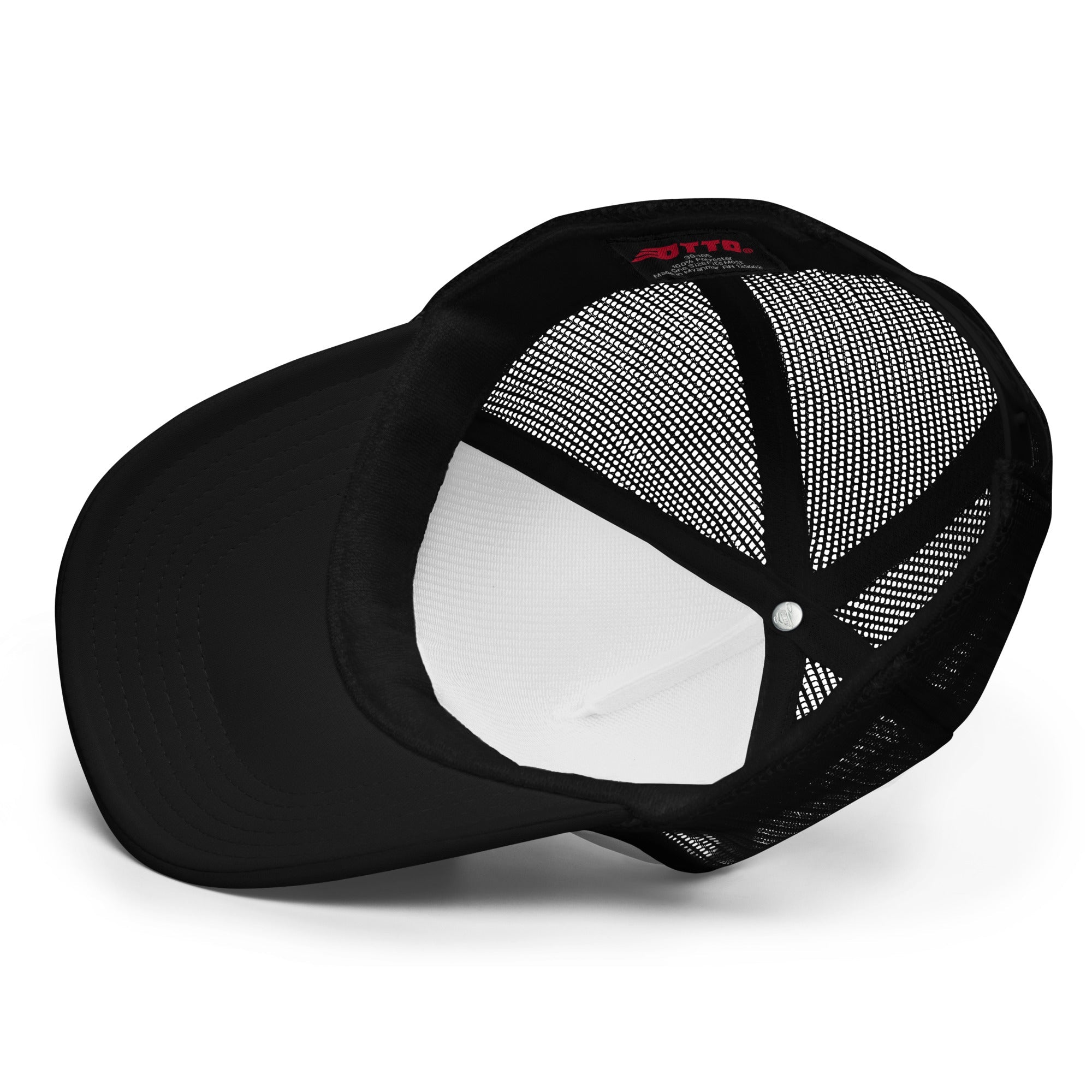 Inside view of a black foam trucker hat with mesh panels and curved brim