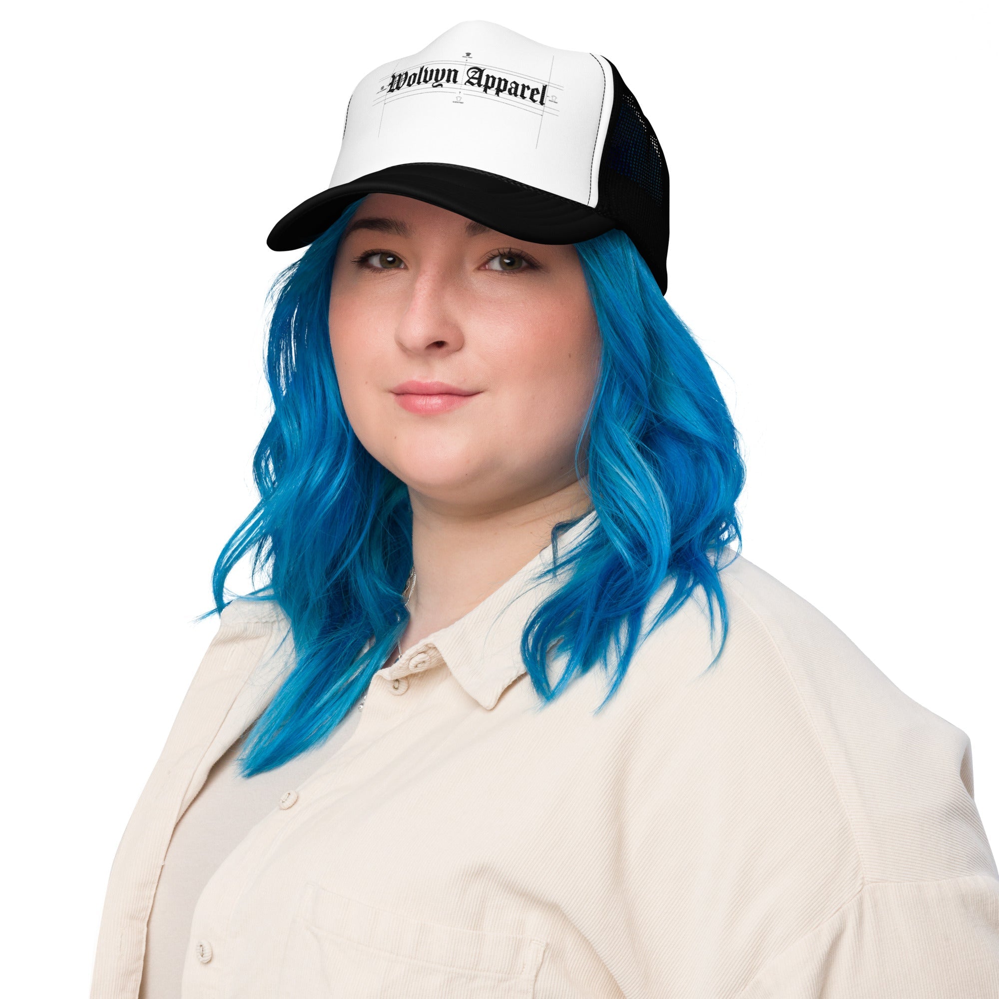 Woman with blue hair wearing a black and white foam trucker hat with gothic text design