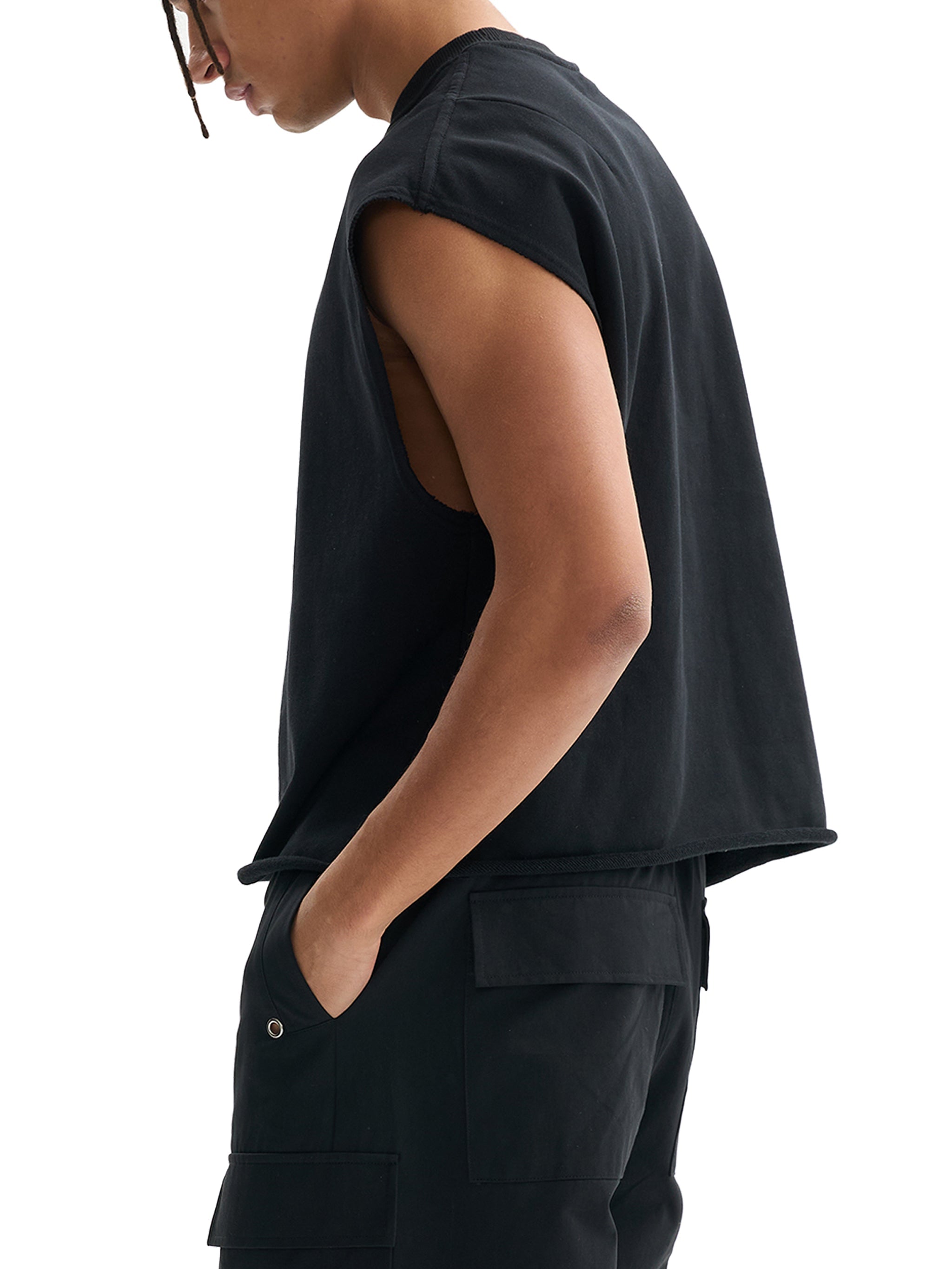 French terry black boxy tank top with wide armholes, styled on a male model