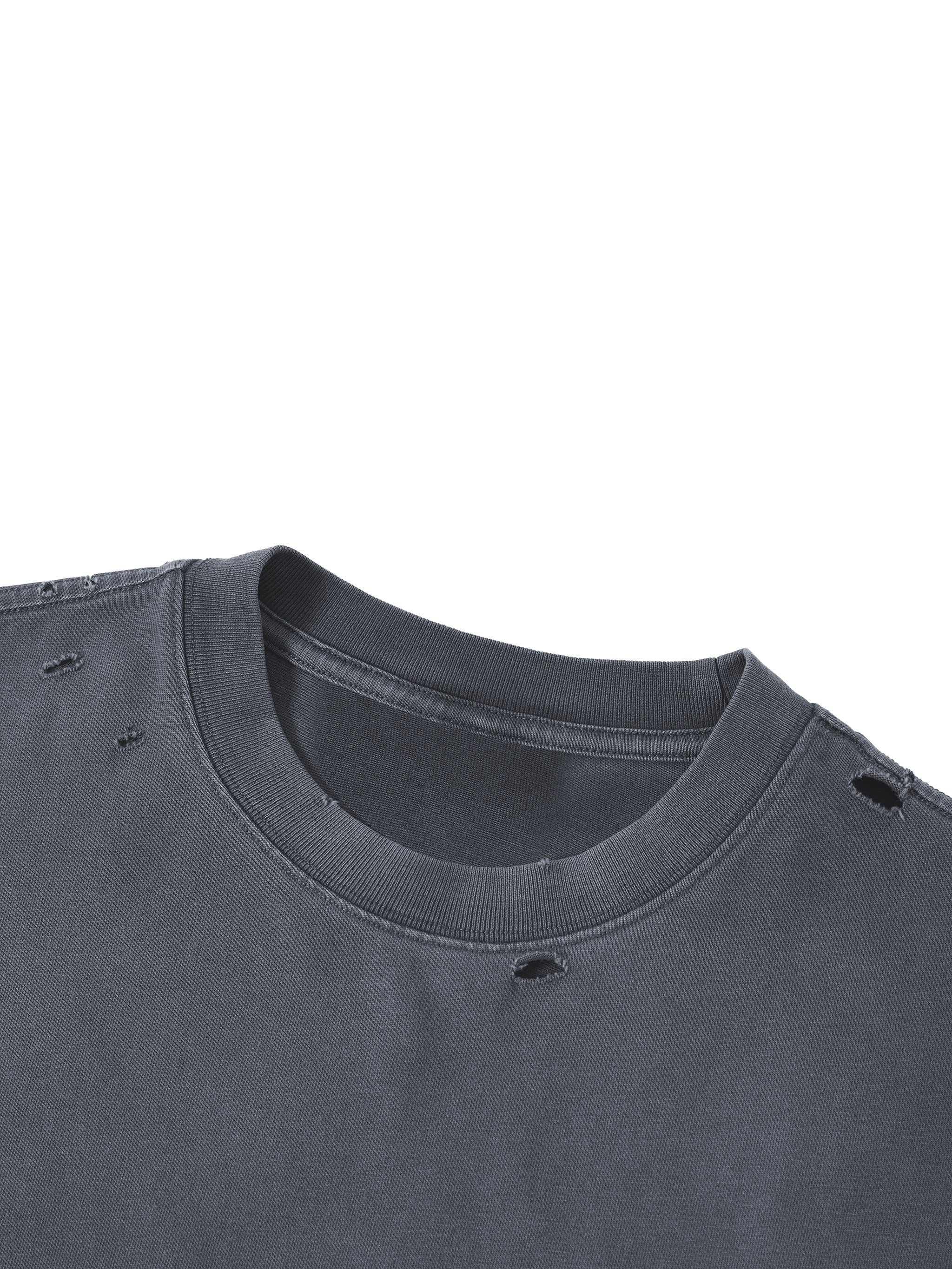 Washed black boxy oversized t-shirt with distressed holes near the collar and shoulders