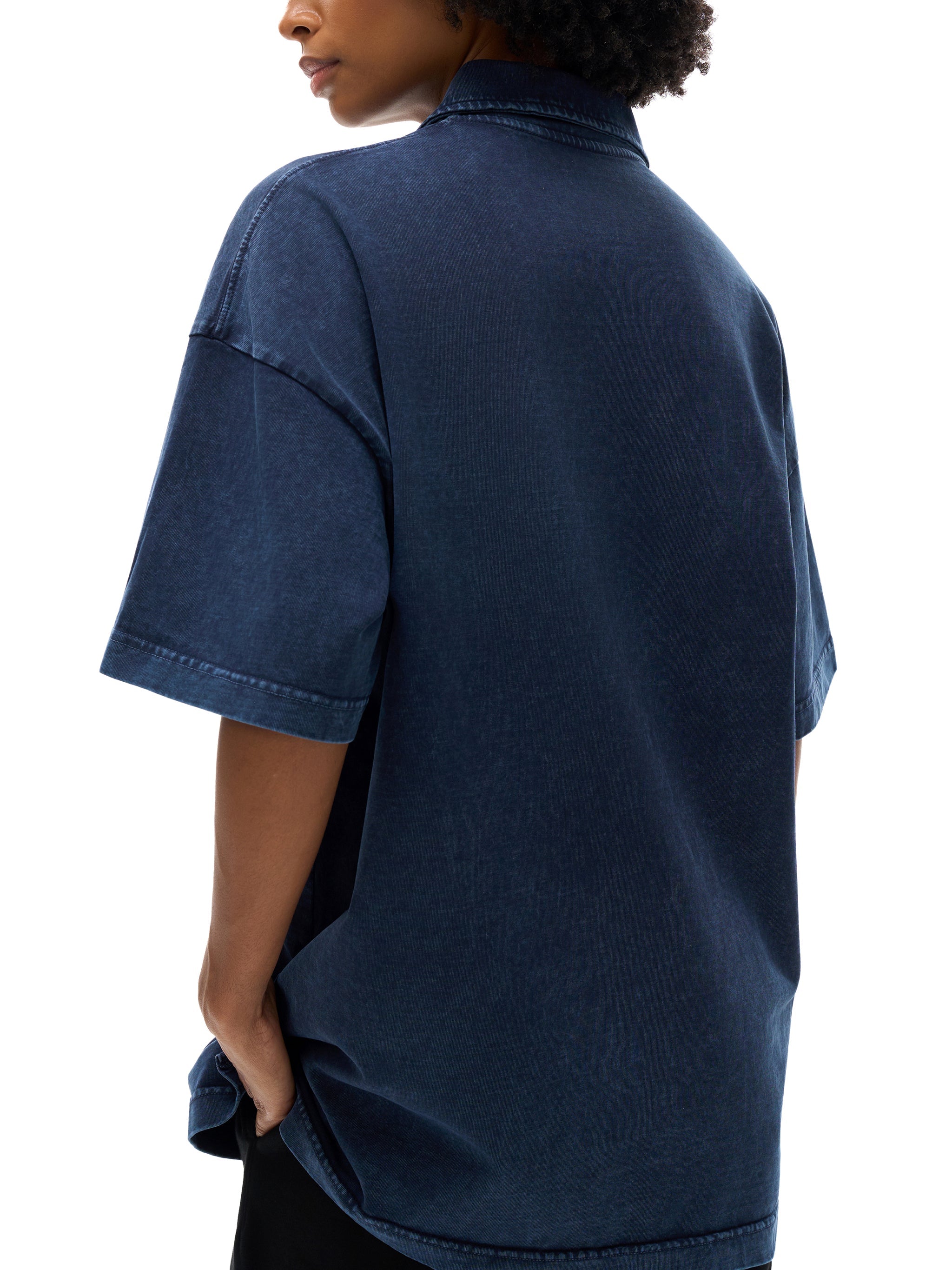 Heavyweight snow washed navy polo t-shirt with relaxed fit, shown from the back