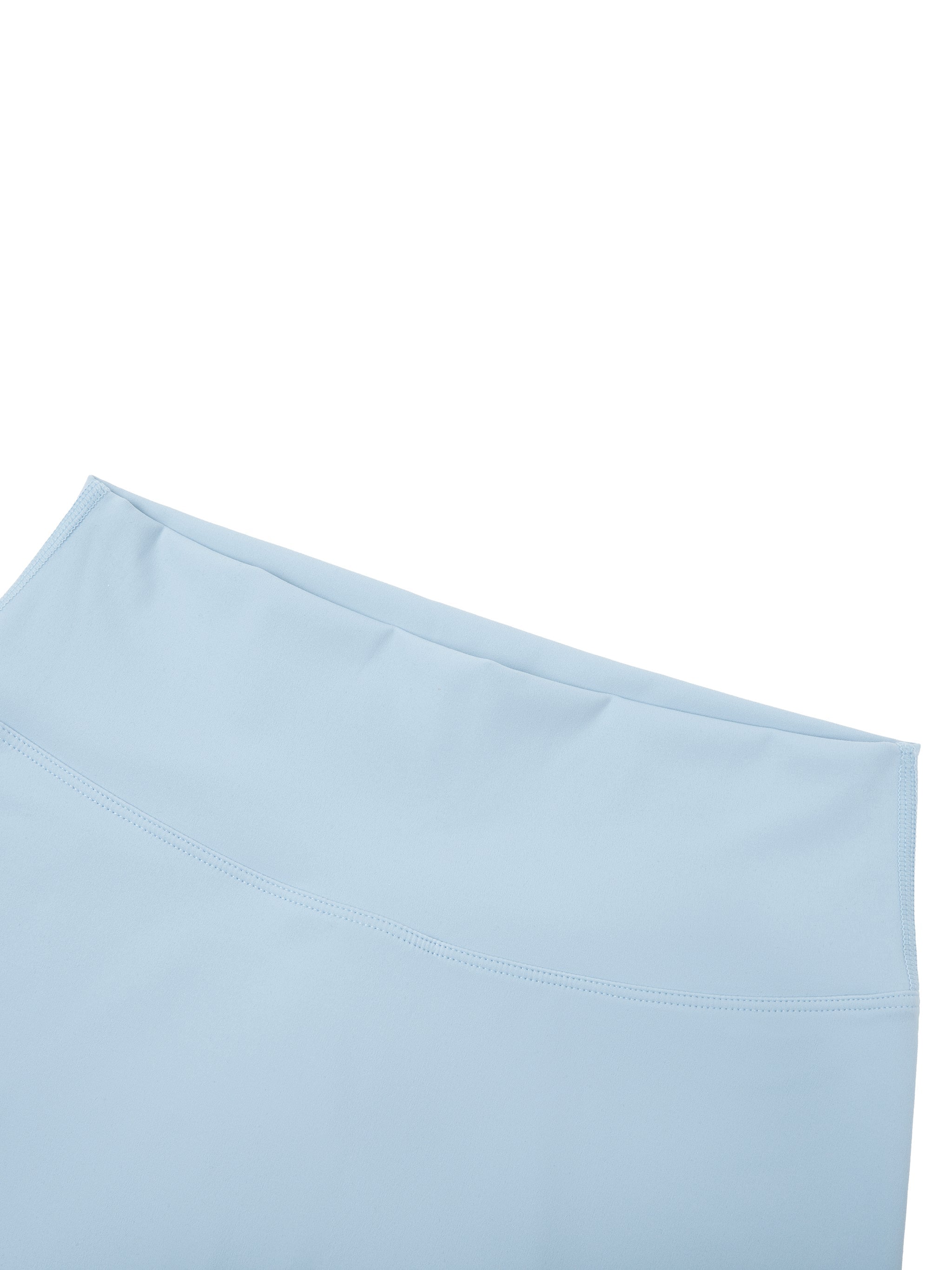 Light blue high-waisted biker shorts in soft stretch fabric, close-up view