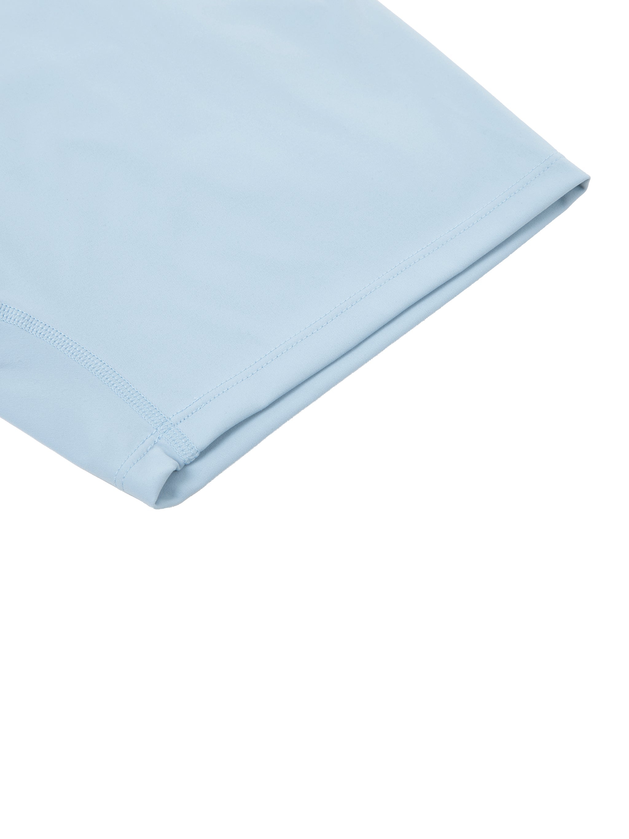 Close-up of light blue high-waisted biker shorts leg with smooth seam detail.