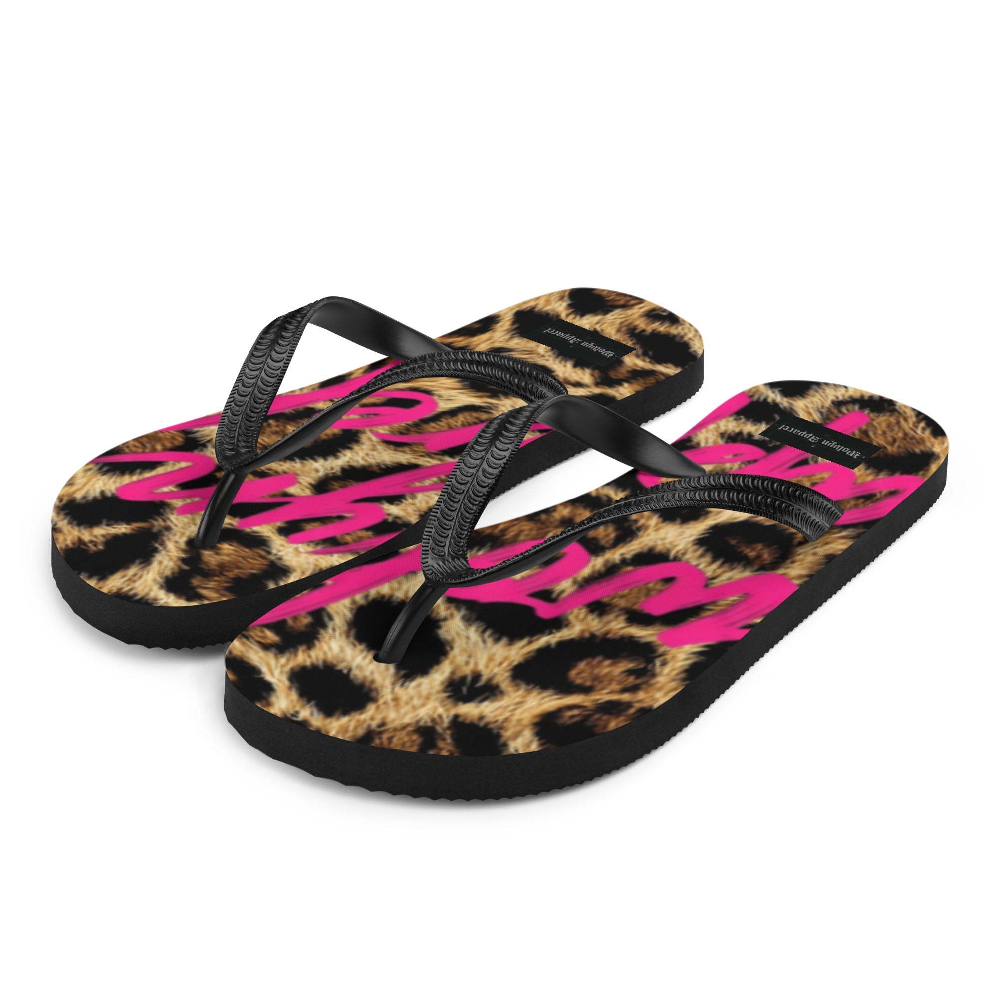 Leopard print flip flops with black straps and bold pink lettering on the footbed