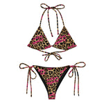 Leopard print string bikini set with pink script lettering and adjustable ties, front view.