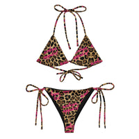 Leopard print string bikini set with pink script lettering and adjustable ties, front view.