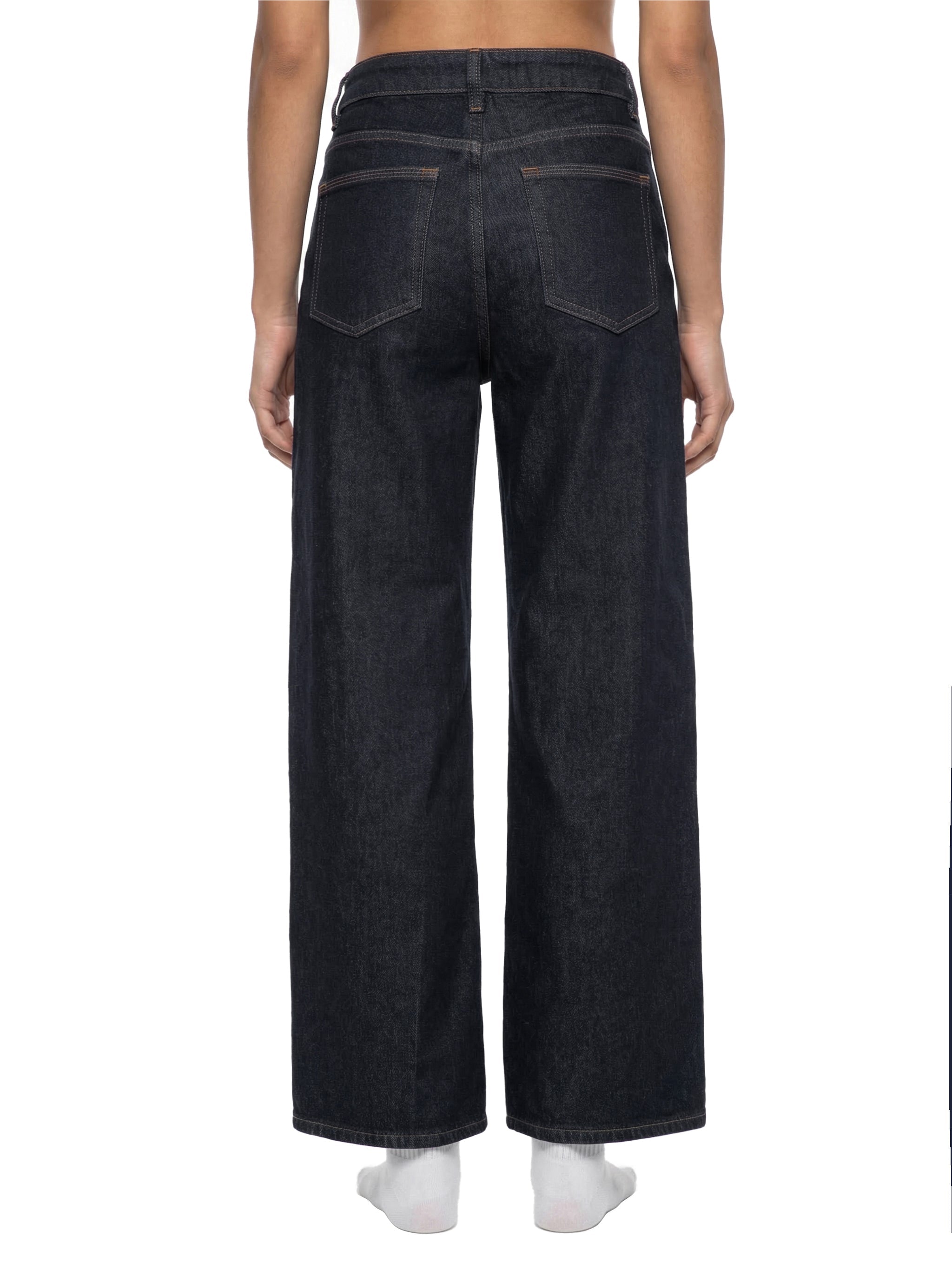 Back view of woman wearing straight leg dark wash denim jeans with wide fit