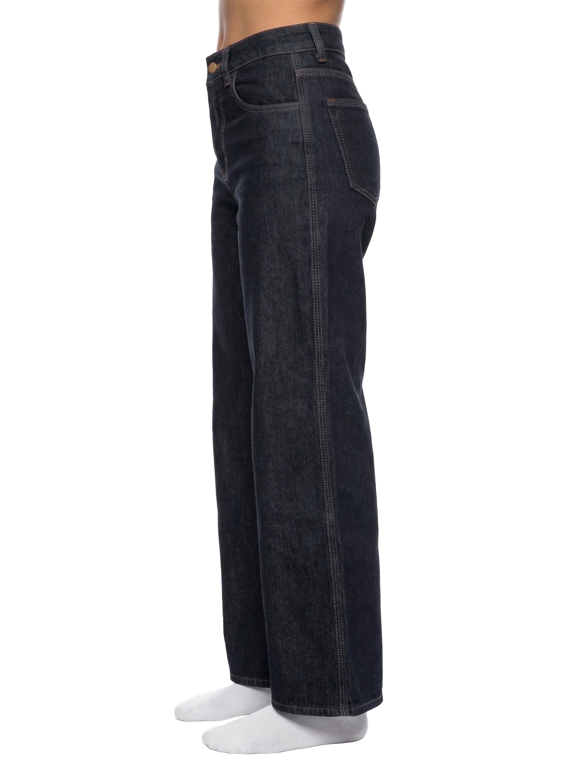 Side view of a woman wearing high-waisted straight leg dark denim jeans