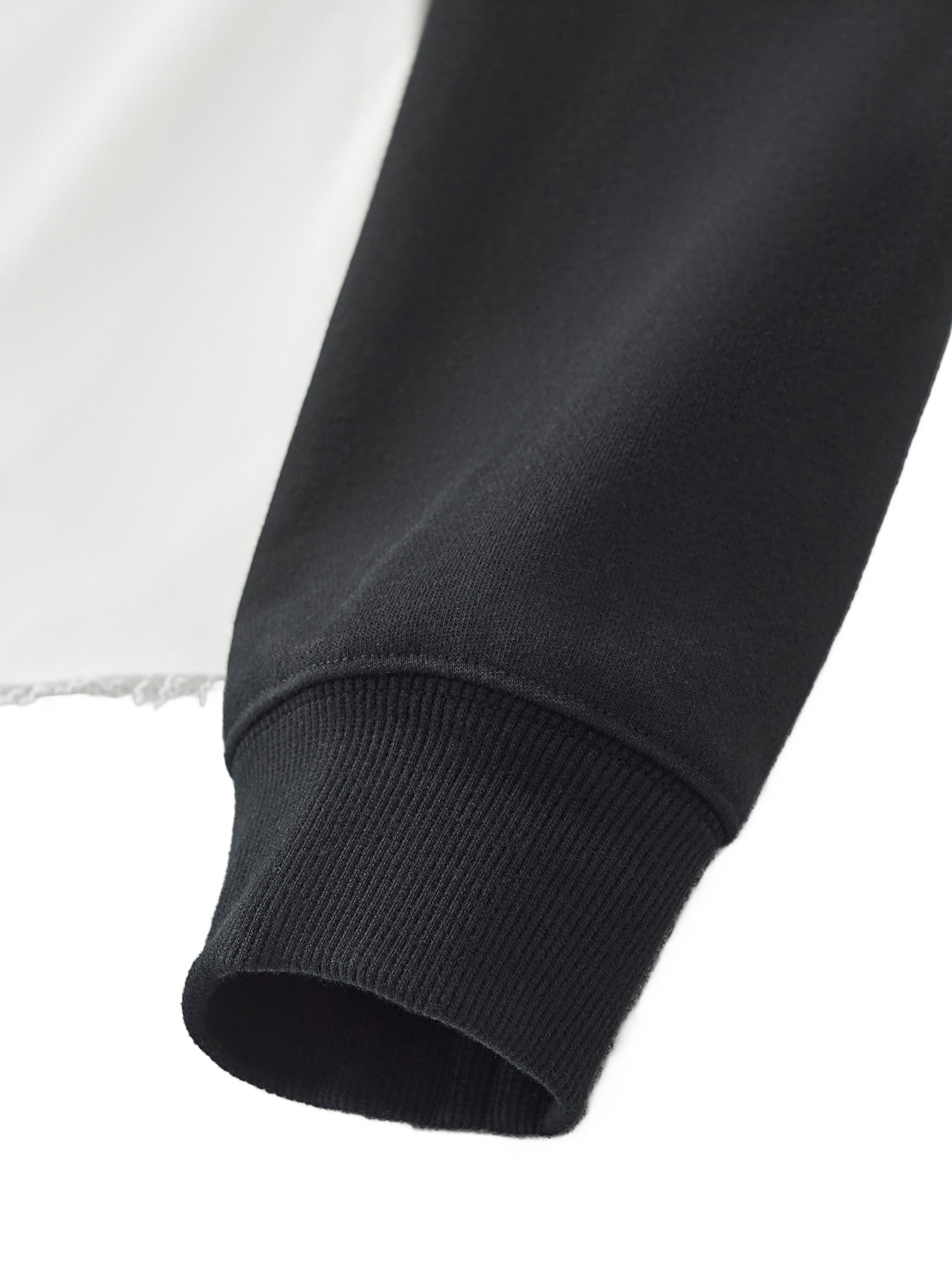 Black ribbed cuff and sleeve detail on color block raw hem raglan crop sweatshirt