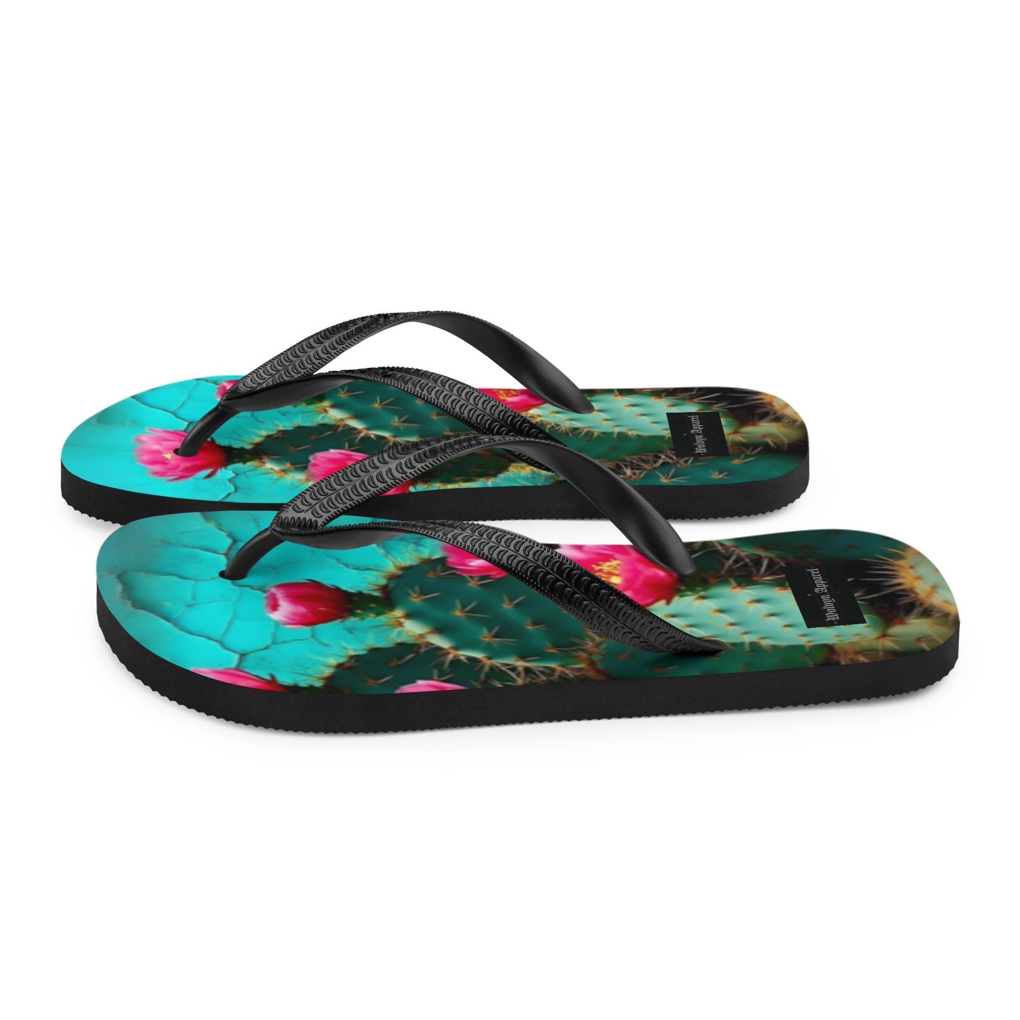 Flip flops with cactus and pink flower print, black straps, white background