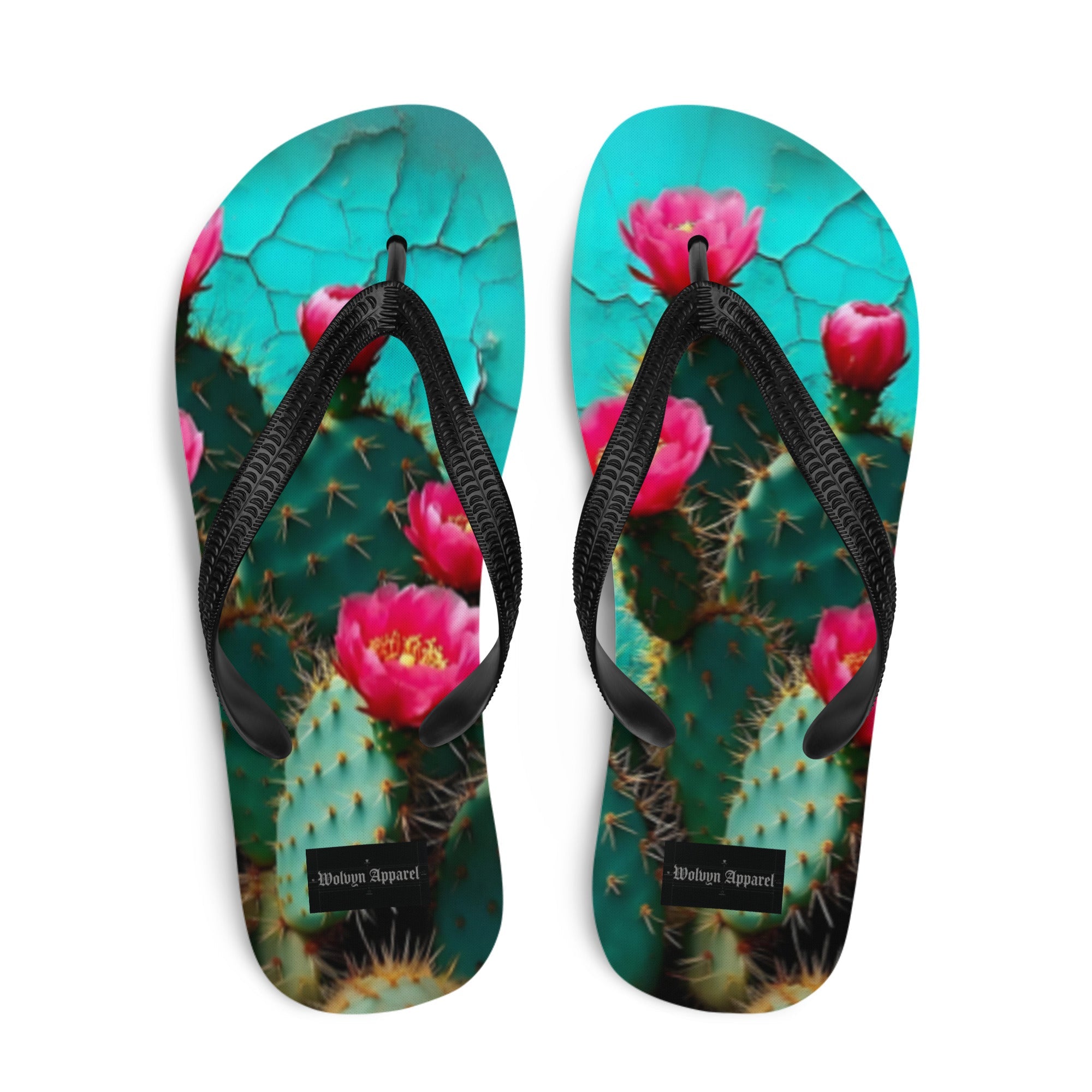 Flip flops with vibrant pink cactus flower print and black straps on turquoise background