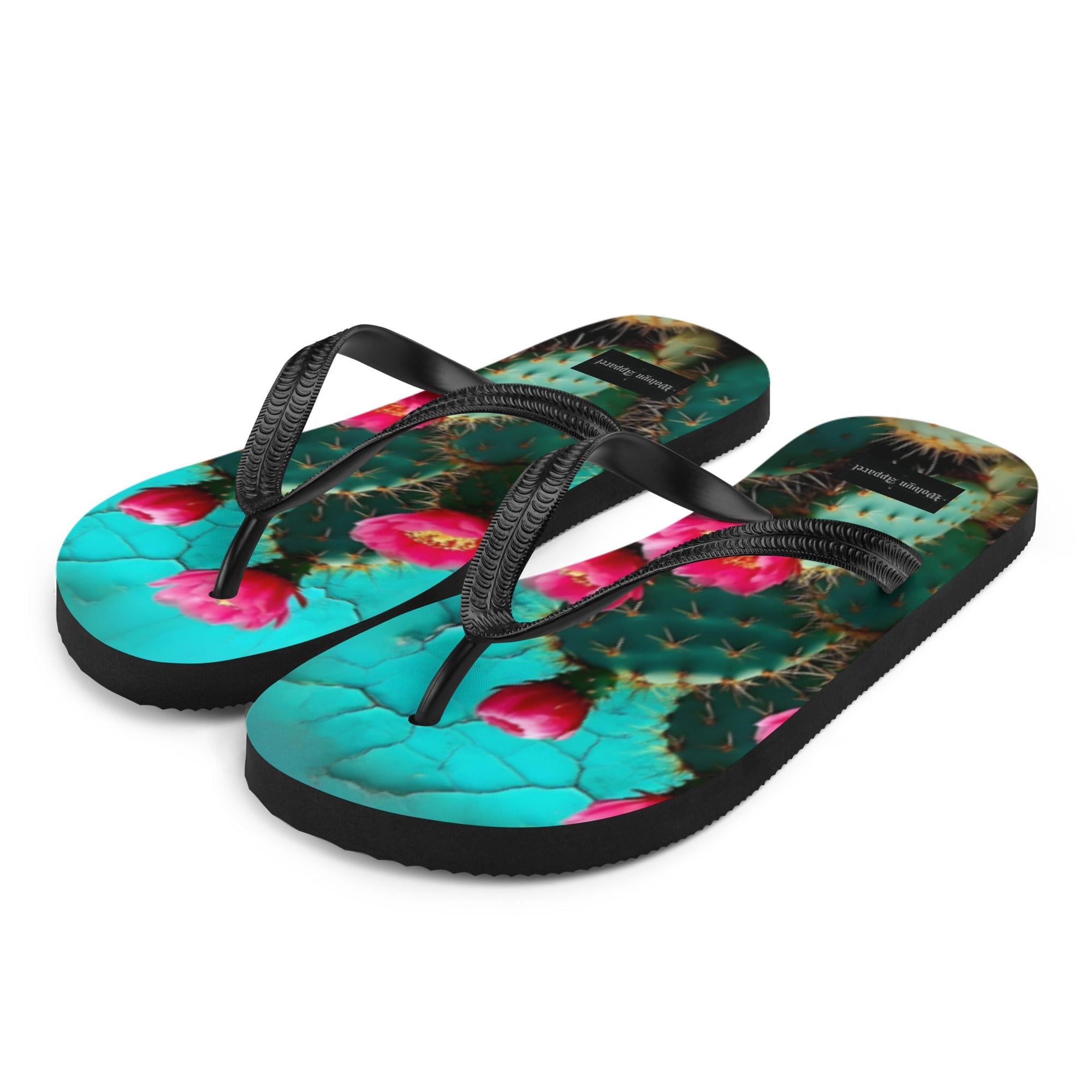 Colorful cactus print flip flops with black straps and vibrant turquoise, green, and pink design.