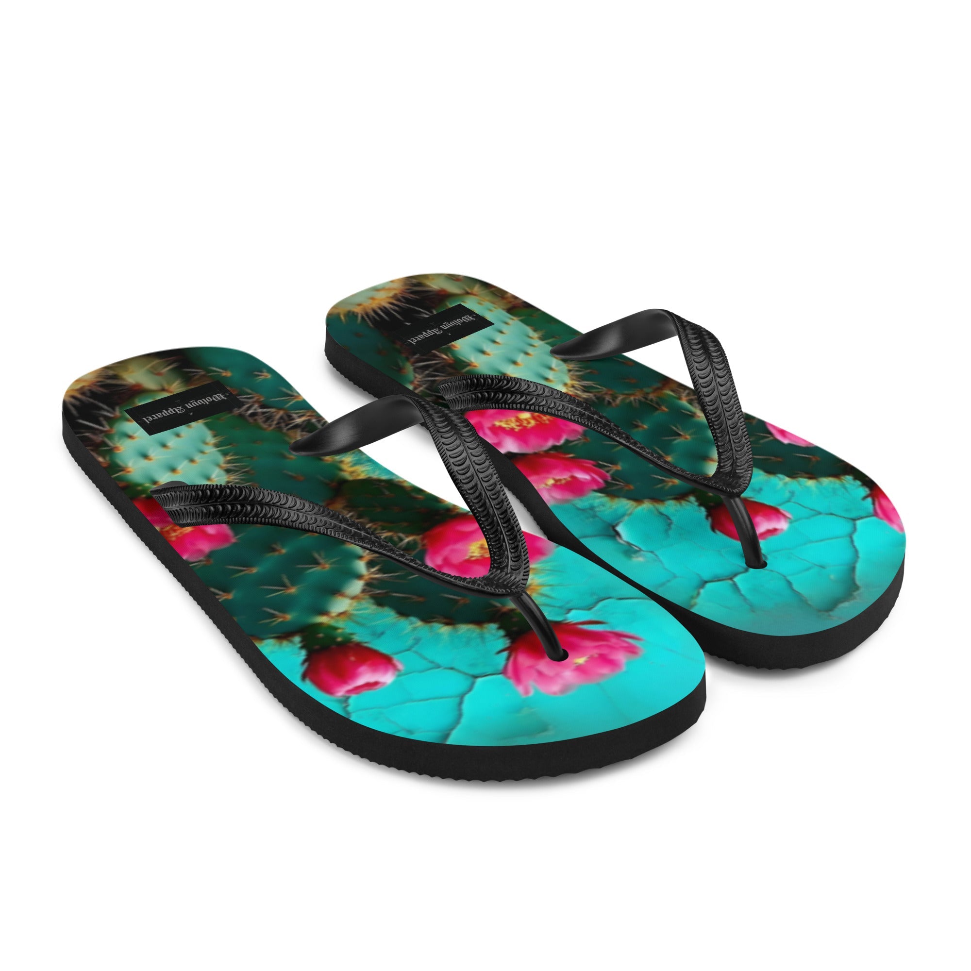 Flip flops with a vibrant cactus and pink flower print on the footbed