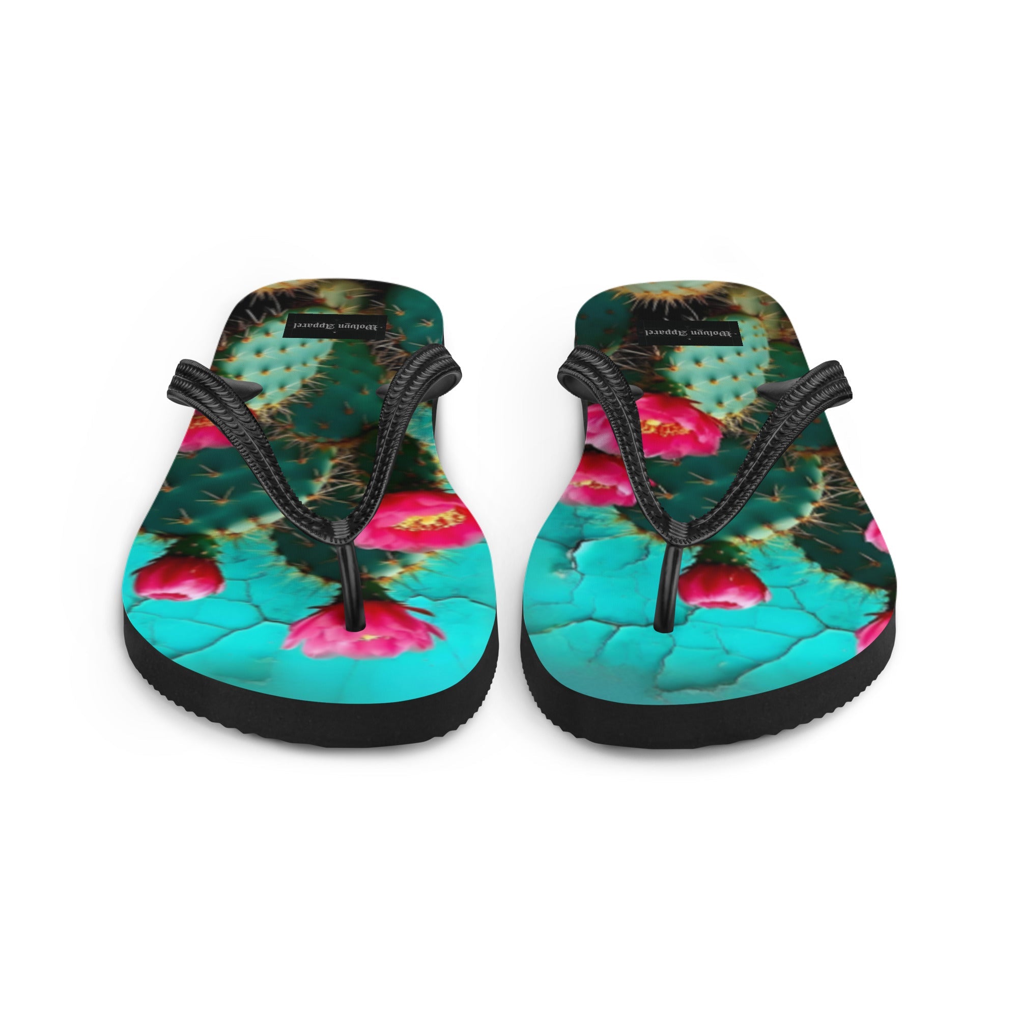 Colorful flip flops with cactus and pink flower design, black straps, vibrant summer footwear