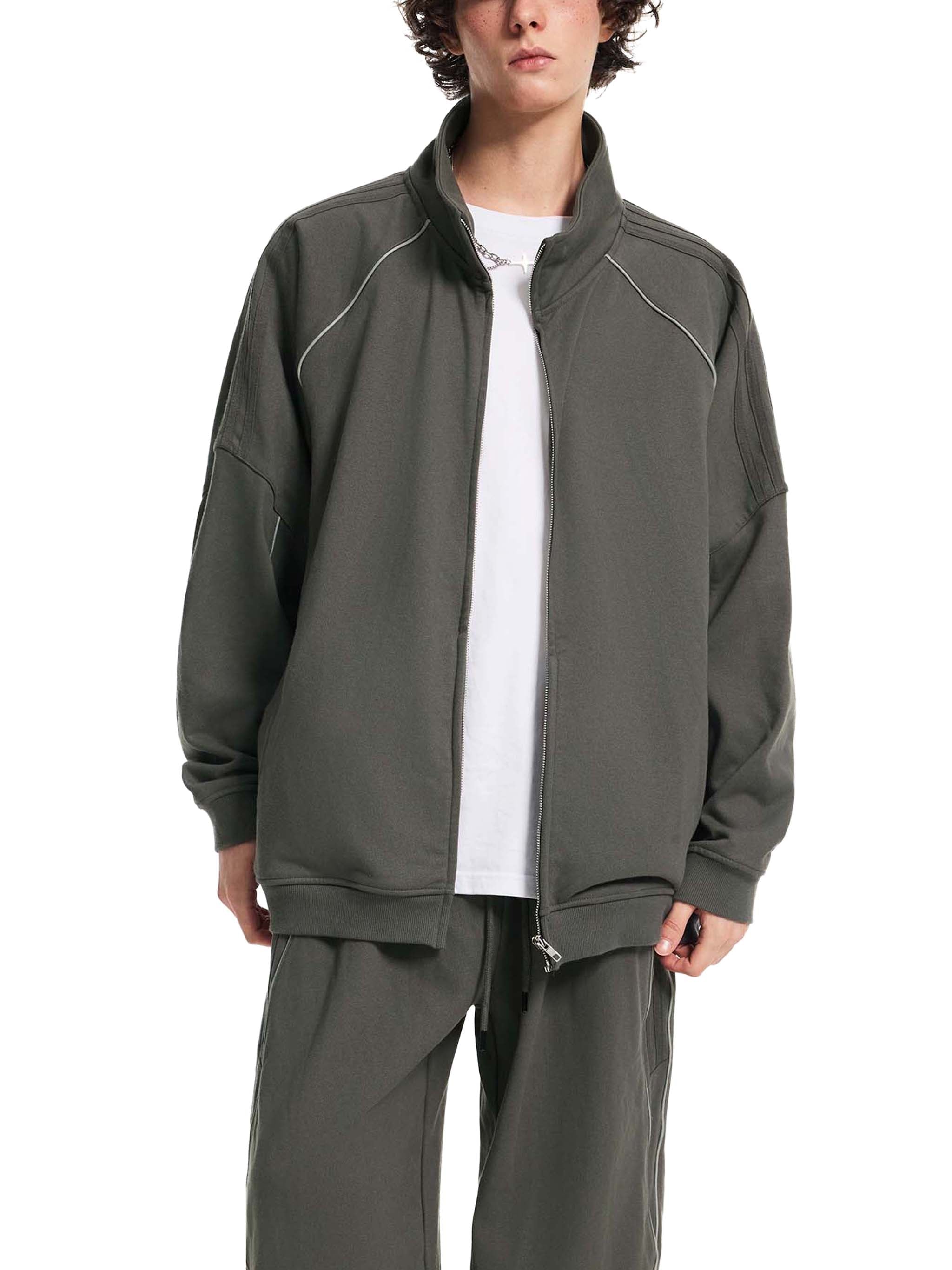 Model wearing dark gray striped raglan sleeve jacket with full zip and relaxed fit