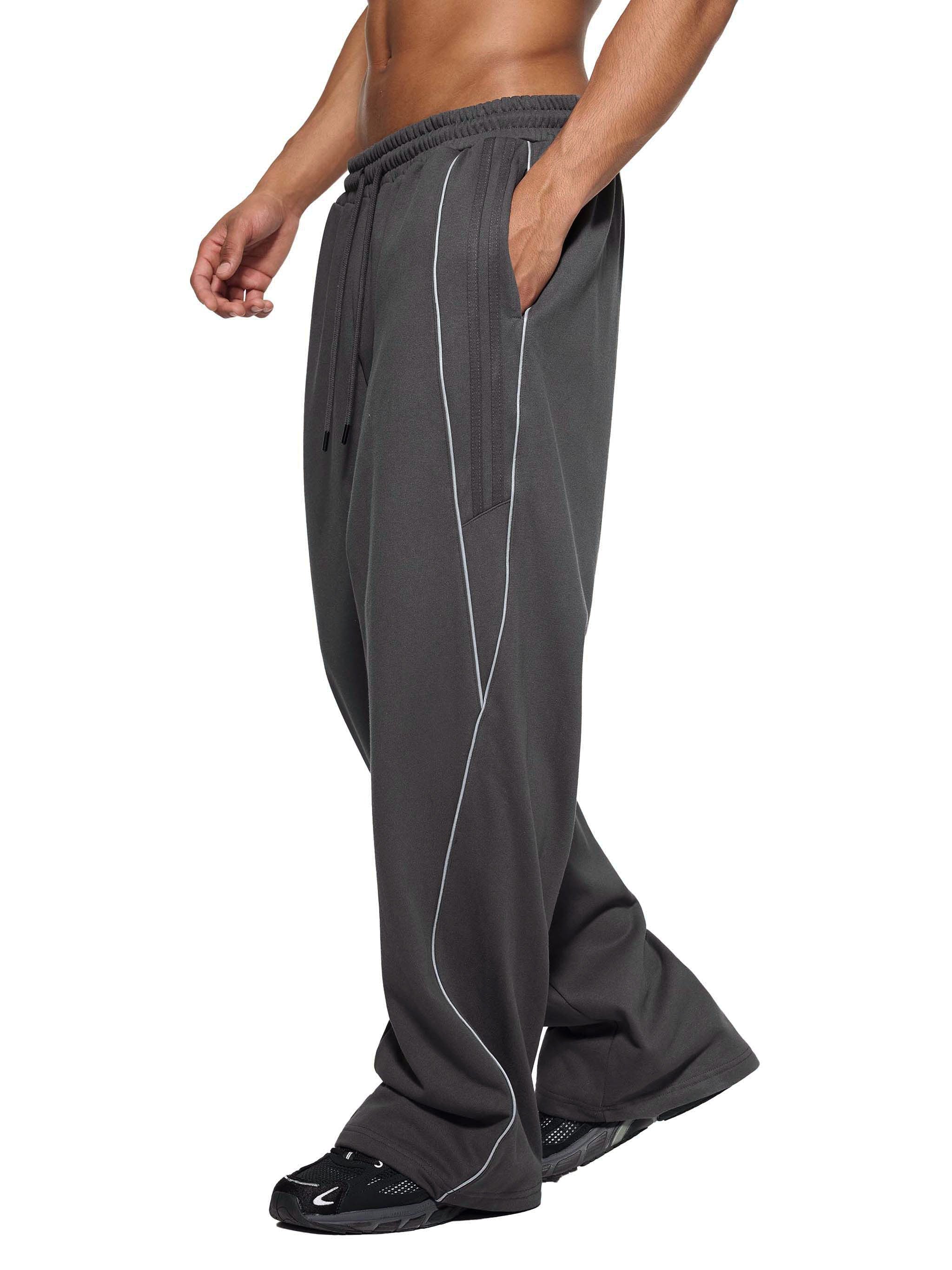 Dark gray reflection striped straight leg sweatpants with white piping, side view
