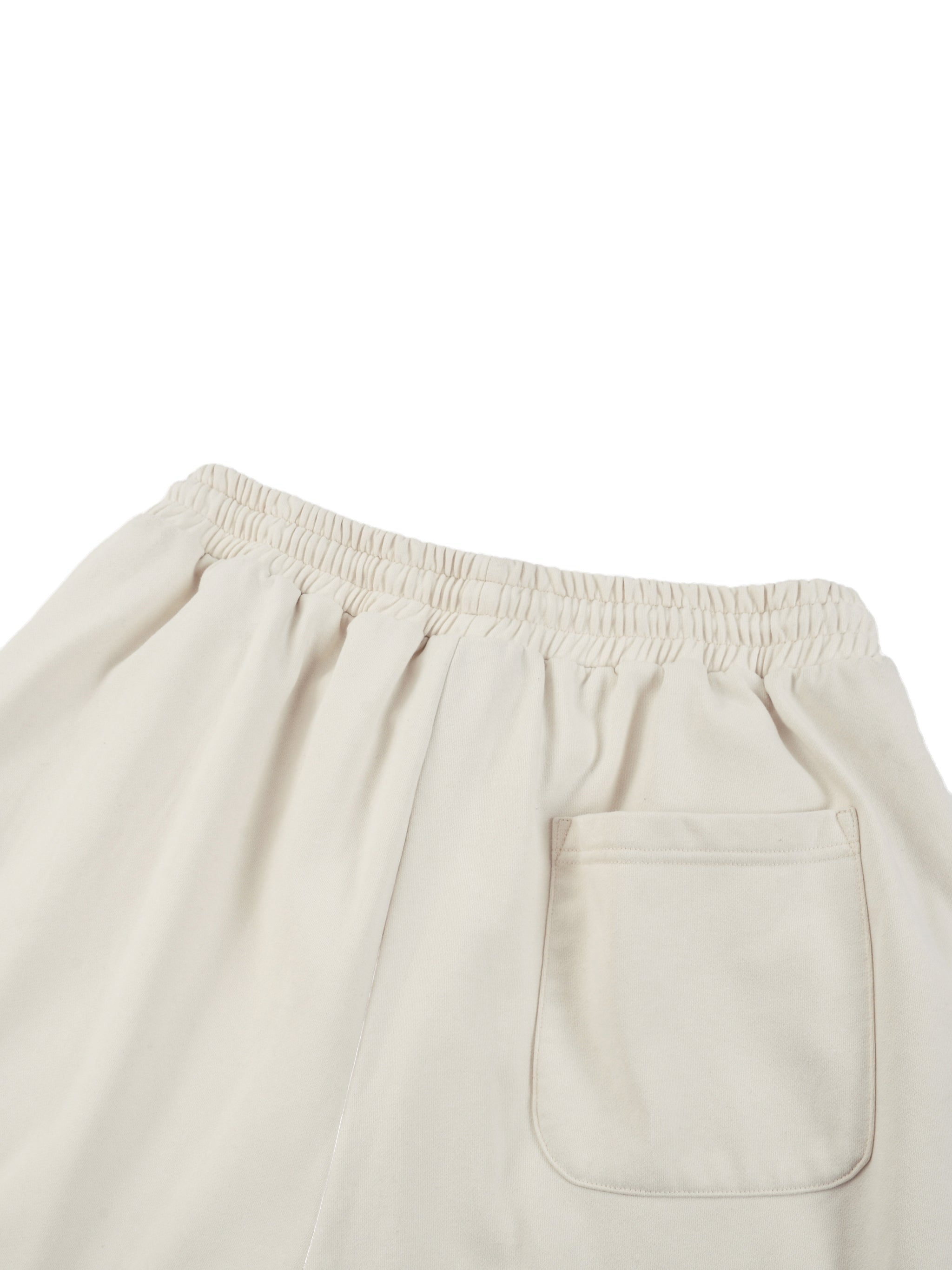 Beige straight-leg sweatpants with elastic waistband and single back pocket