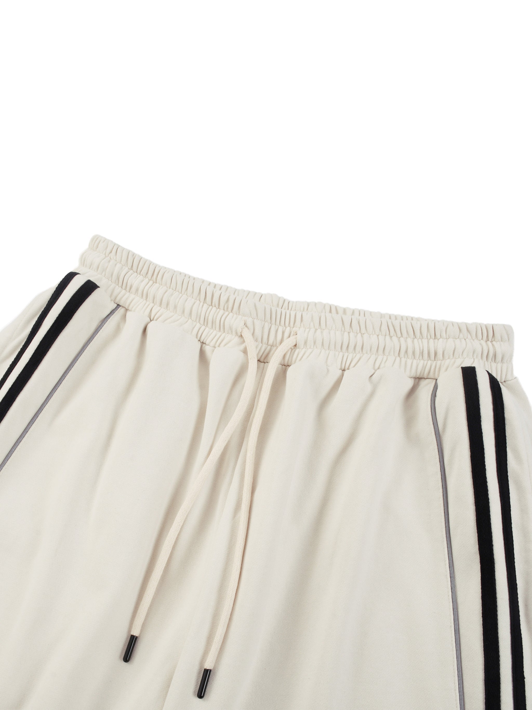 Cream straight-leg sweatpants with black side stripes and drawstring waist