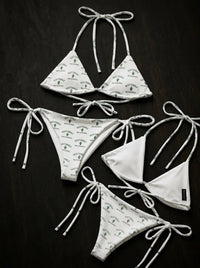 White Scottsdale cactus print string bikinis with tie straps on dark background