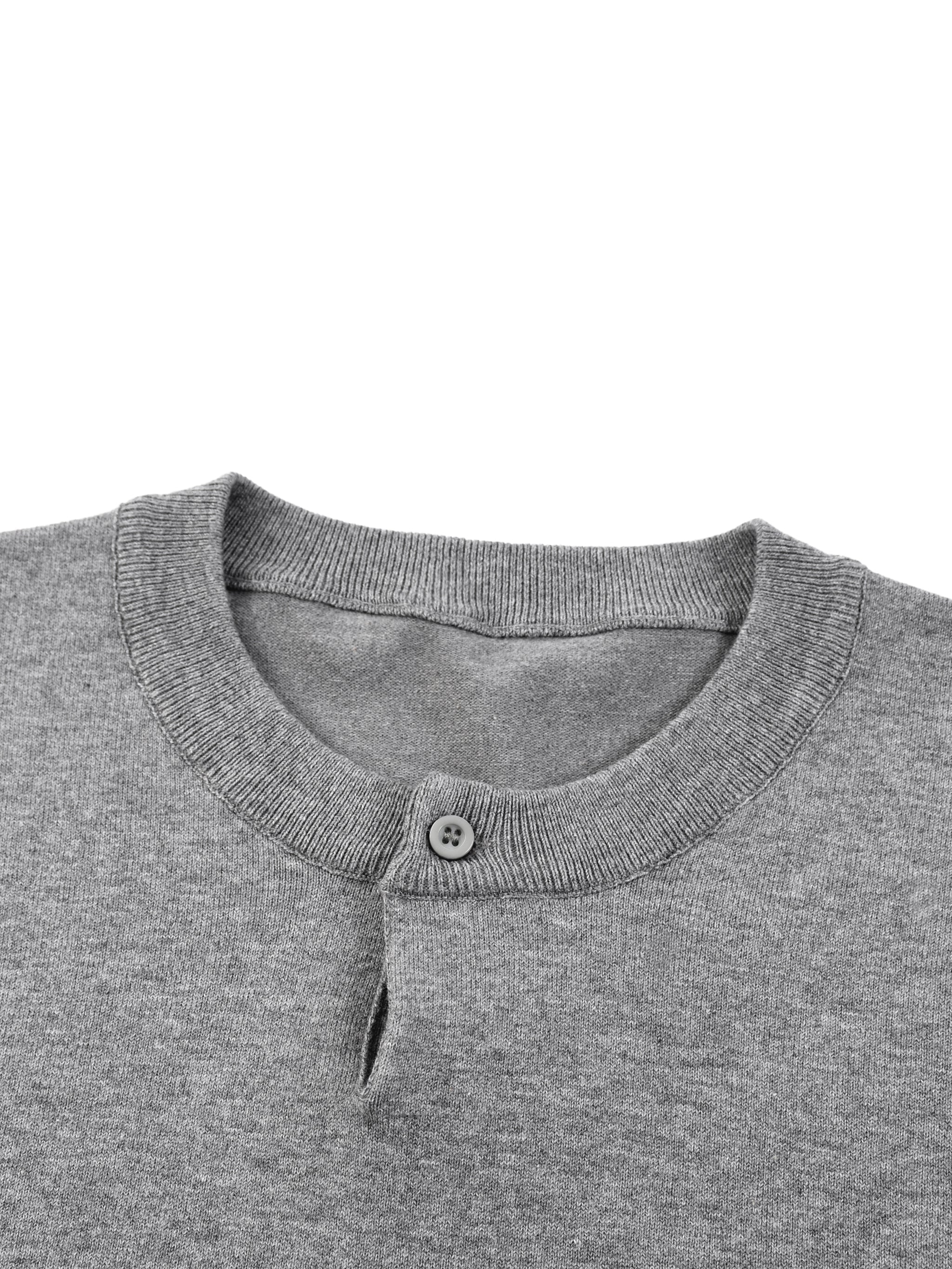 Close-up of a grey cotton knit short sleeve Henley T-shirt with a single button collar.