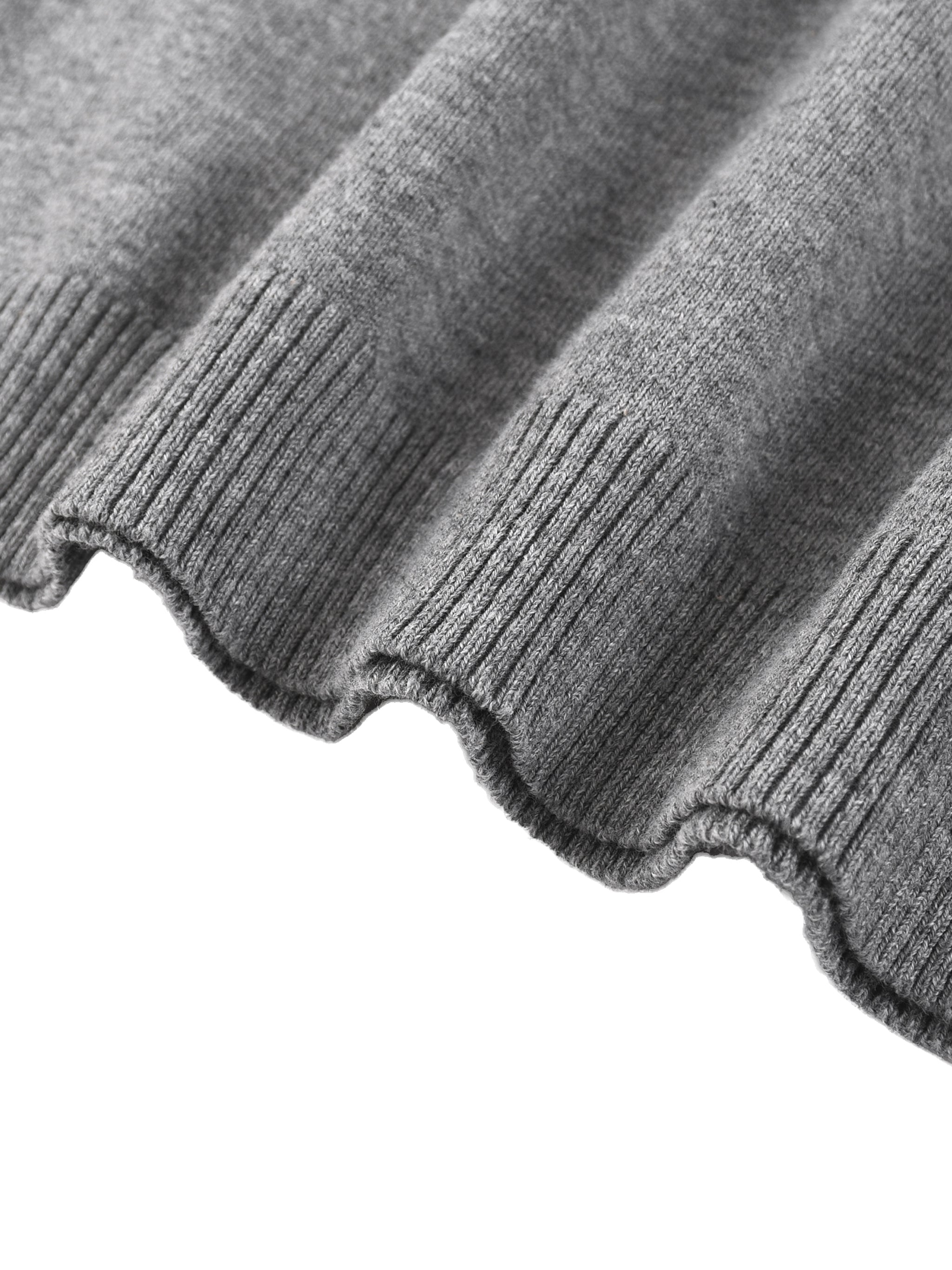 Close-up of ribbed hem on grey cotton knit fabric, showcasing heavyweight texture.