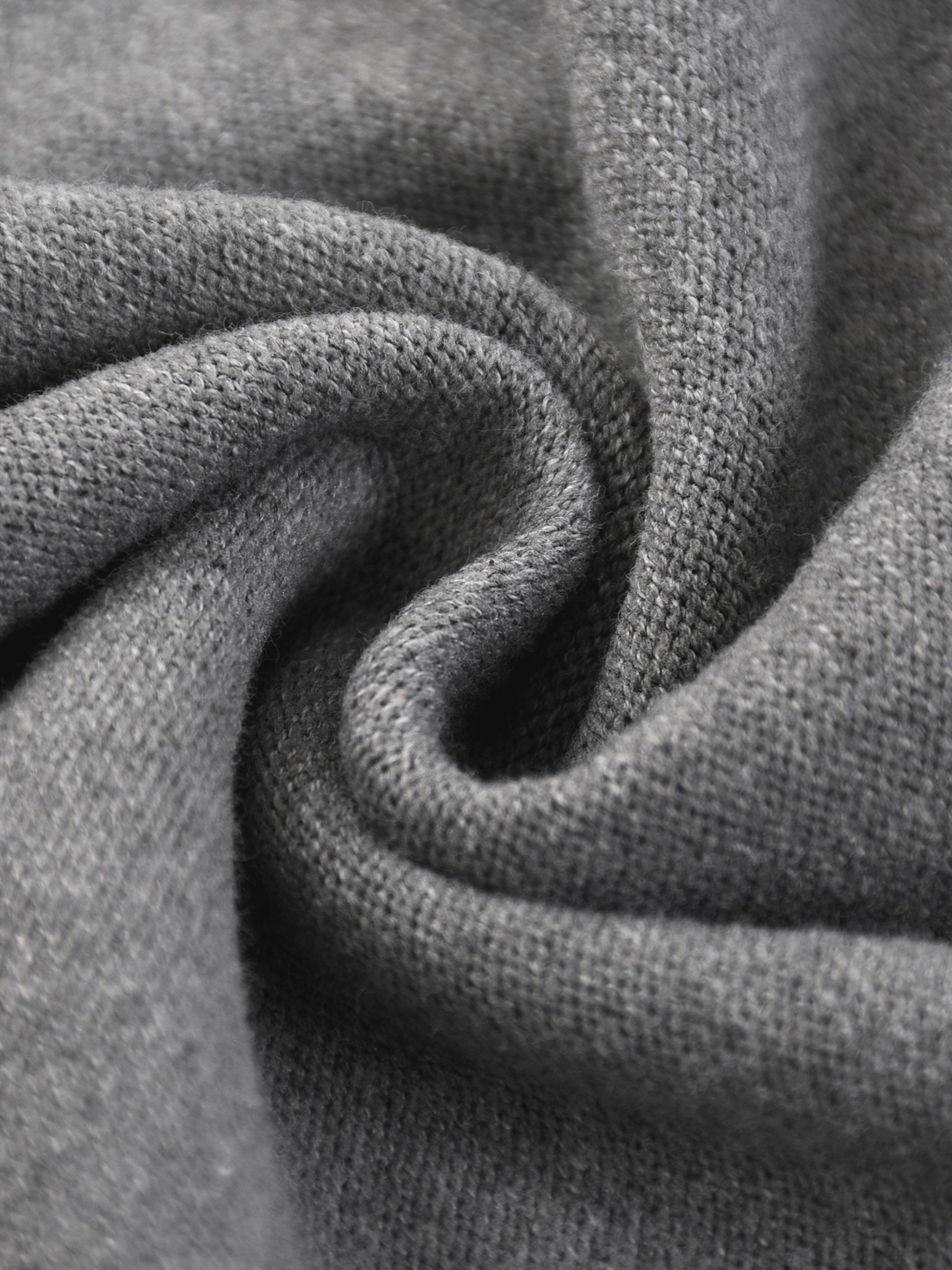 Closeup of heavyweight gray cotton knit fabric with soft texture and fine weave