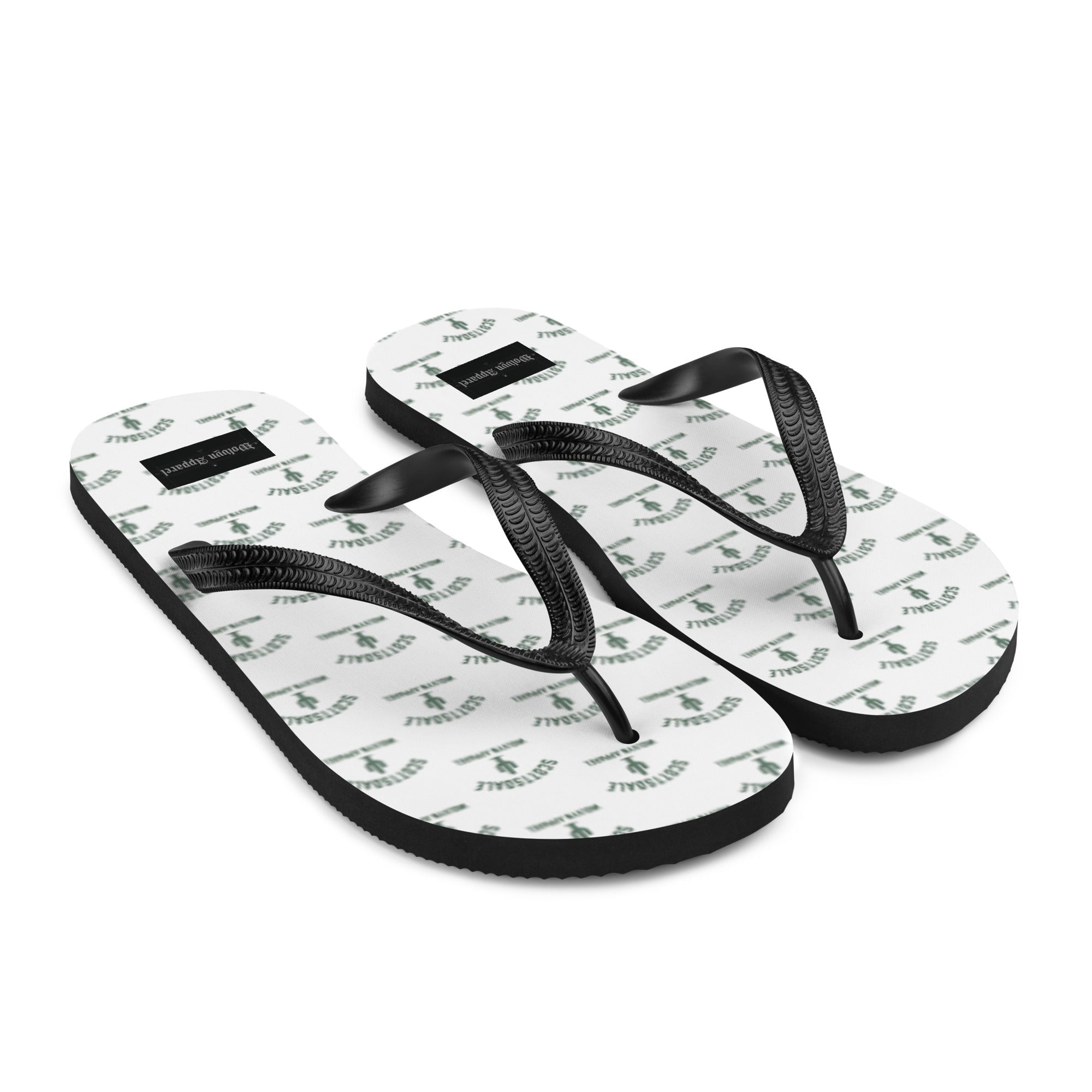 White flip flops with black straps and green Scottsdale palm tree pattern on soles