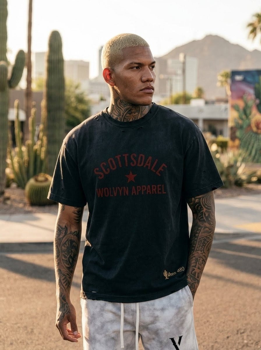 Man wearing vintage washed, distressed black Scottsdale t-shirt outdoors, cactus background