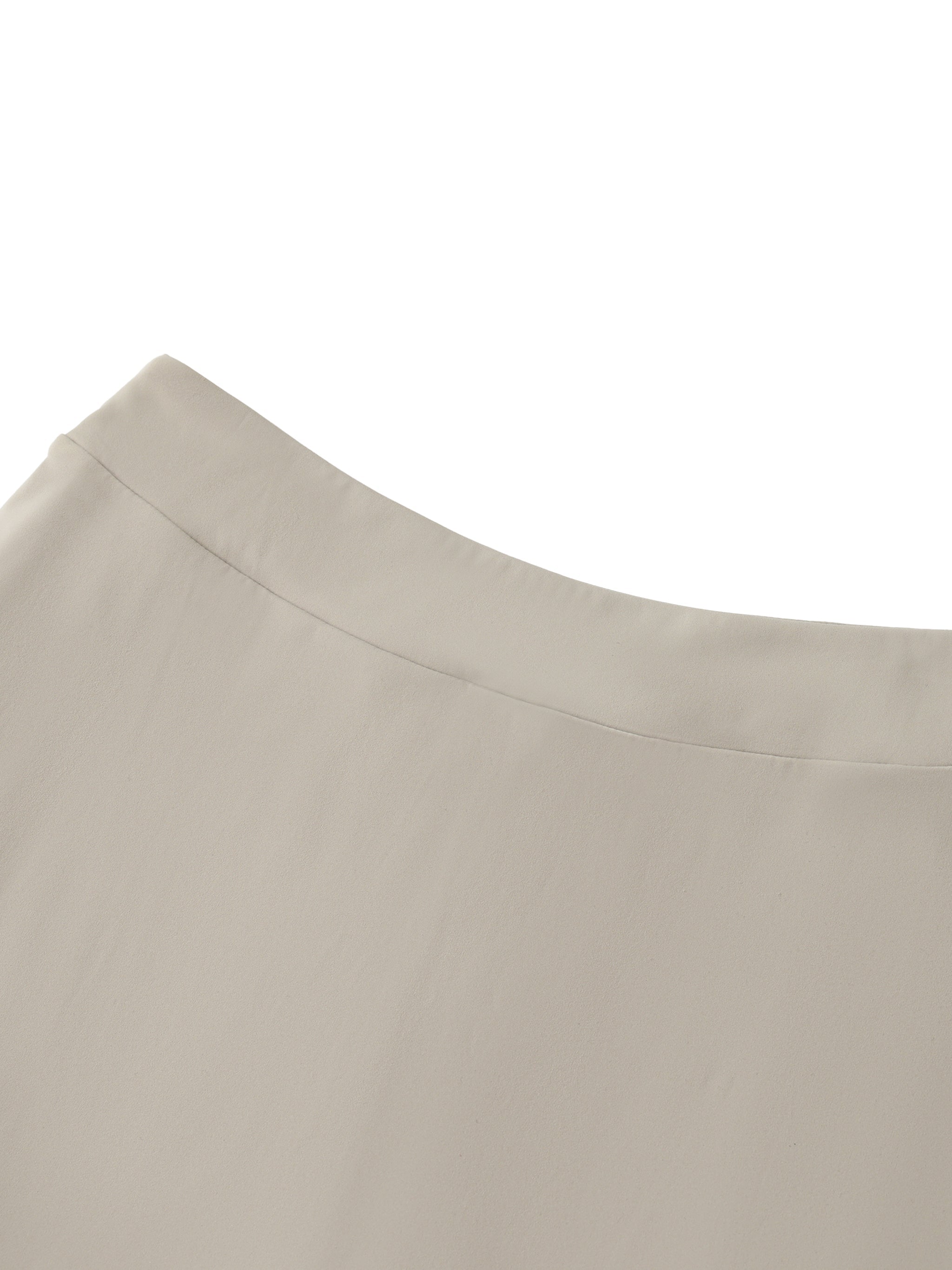 Close-up of beige high-waist A-line skirt fabric and waistband detail
